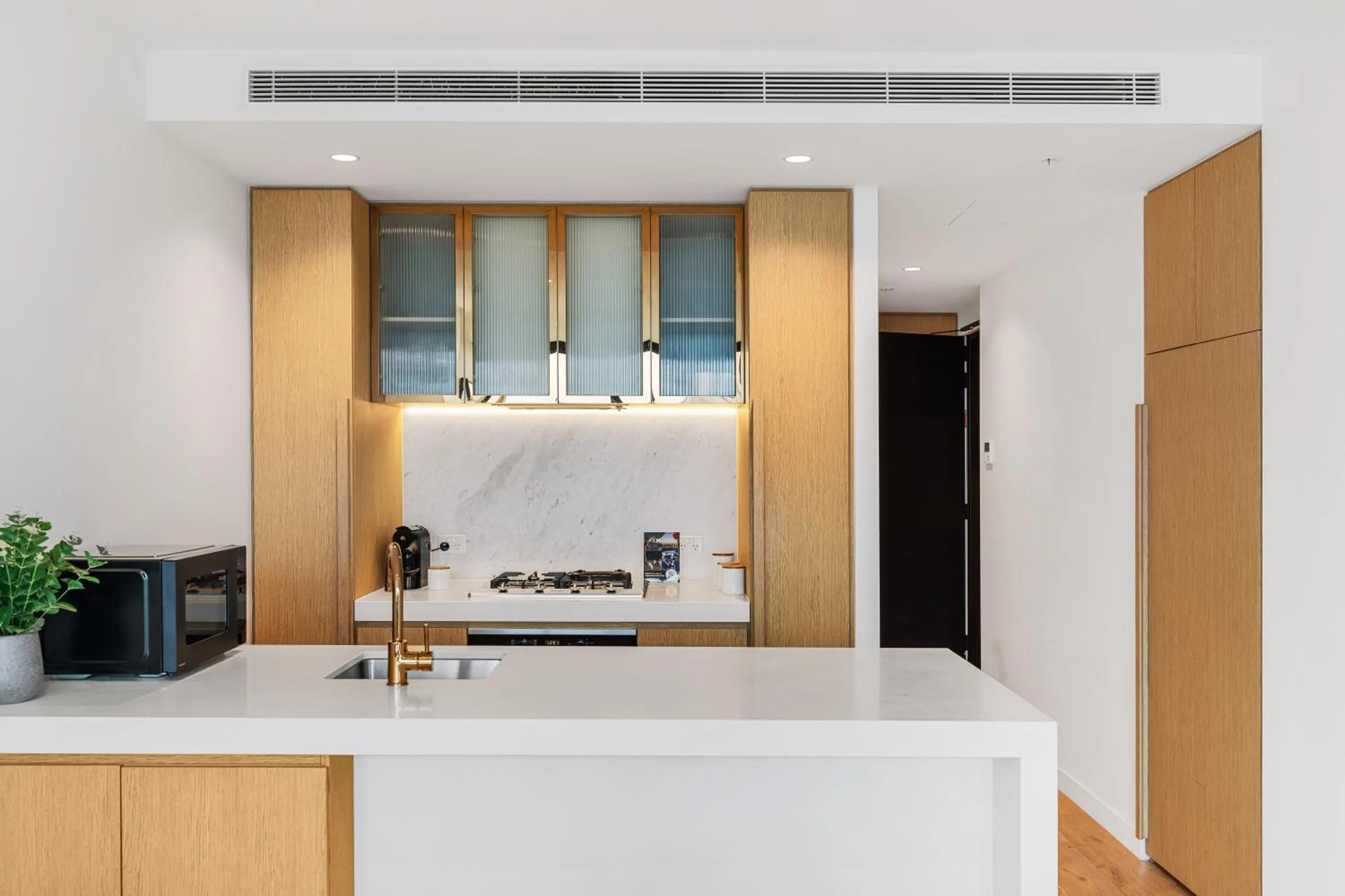 Kitchen or kitchenette in Collins House Apartments by CLLIX