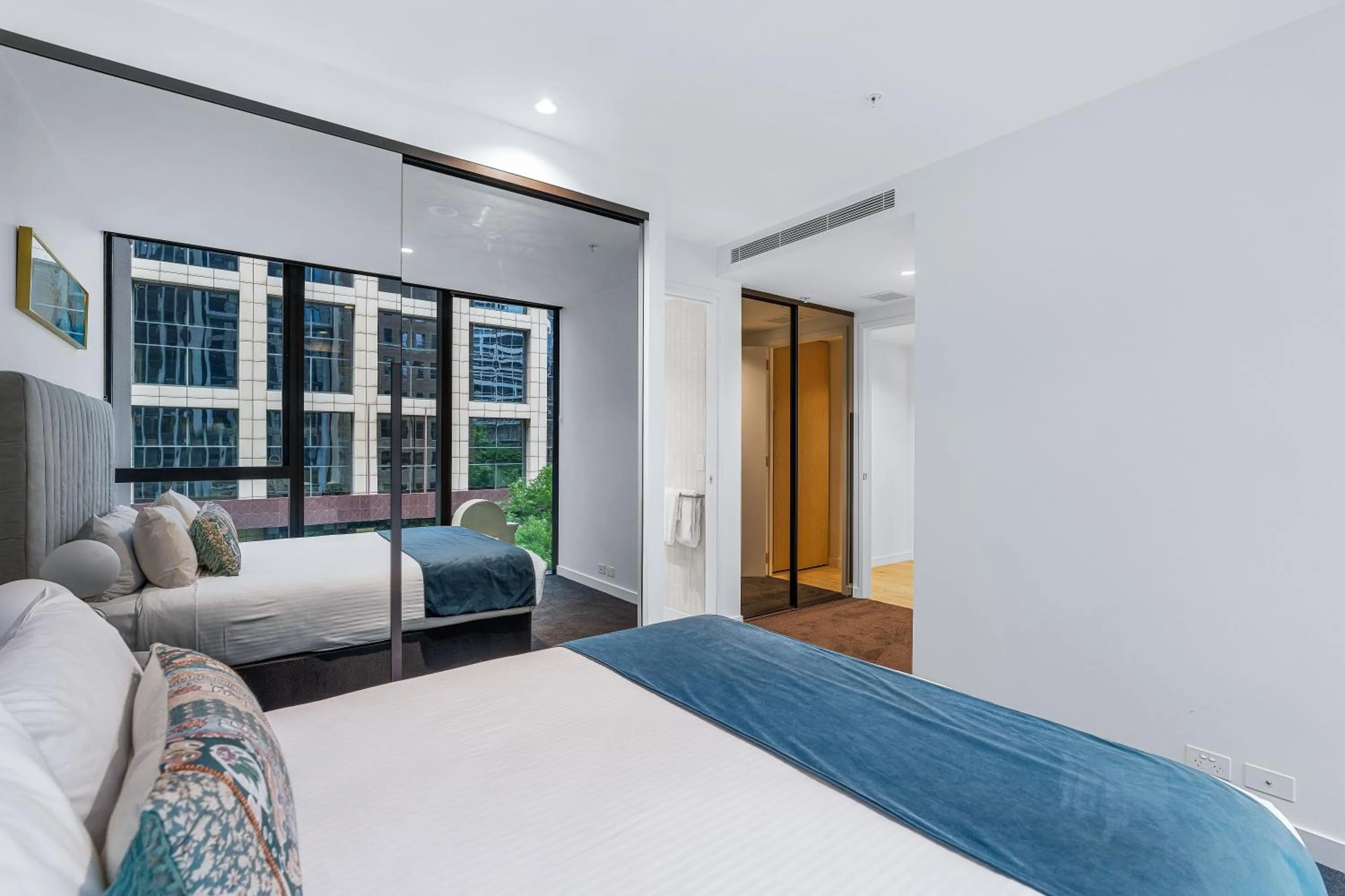 Bed in Collins House Apartments by CLLIX