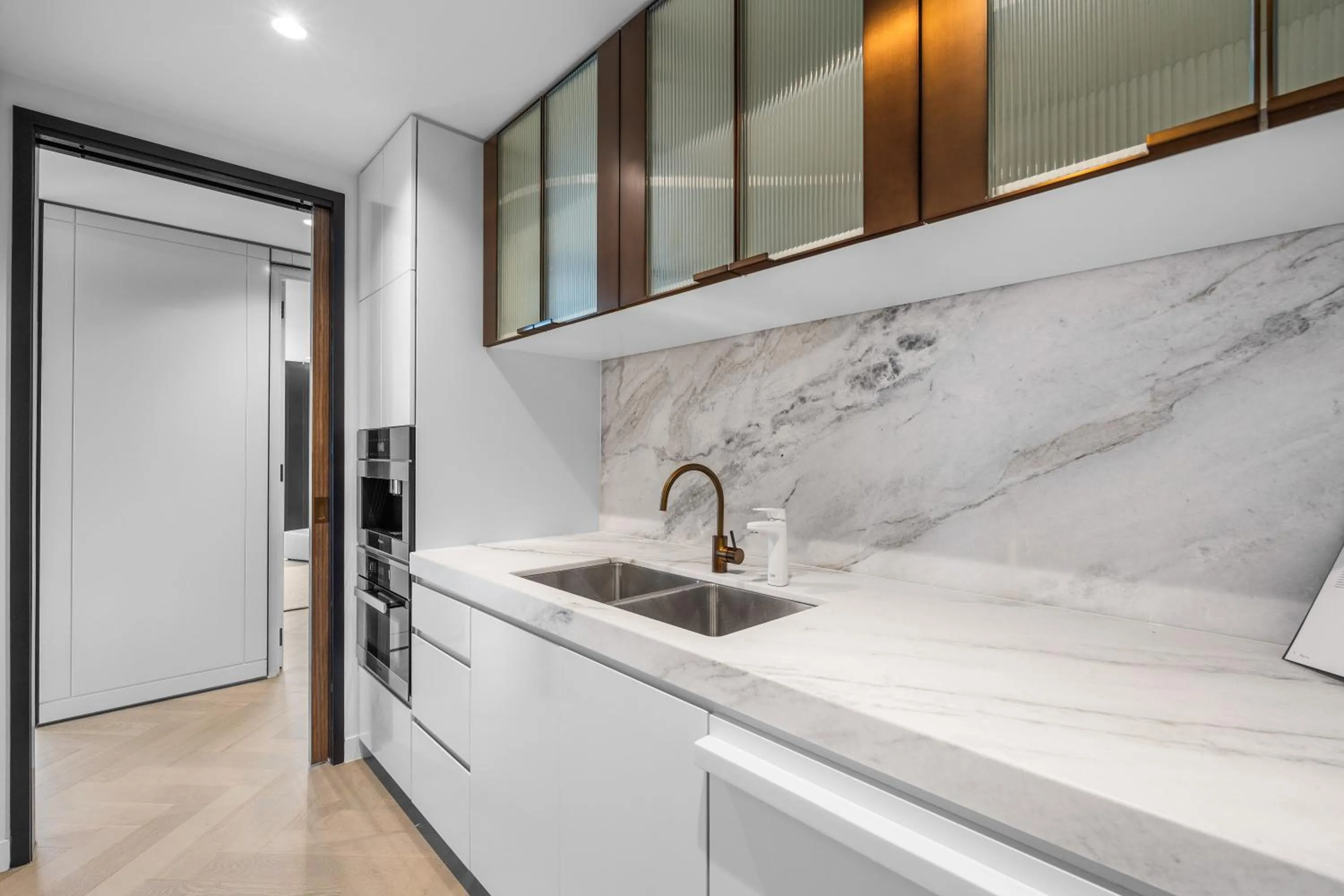 Kitchen or kitchenette in Collins House Apartments by CLLIX