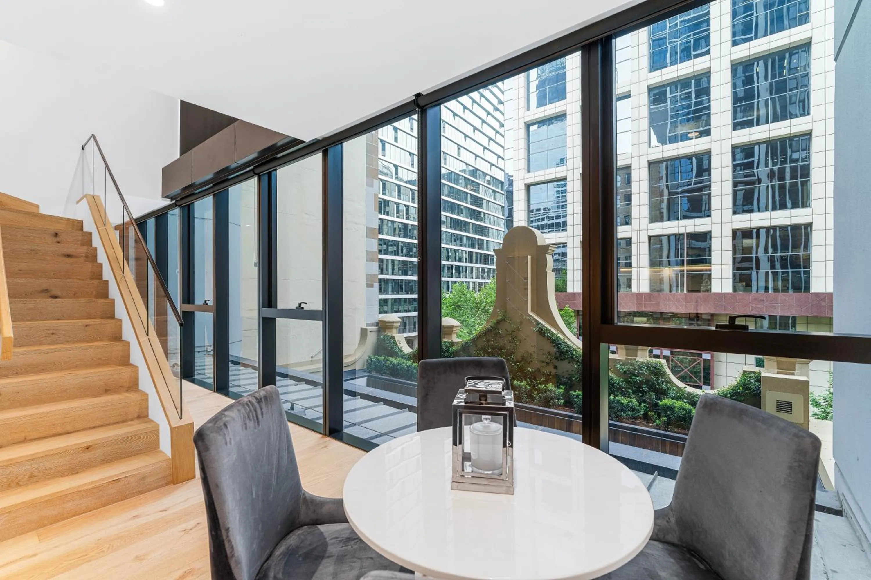 Seating area in Collins House Apartments by CLLIX