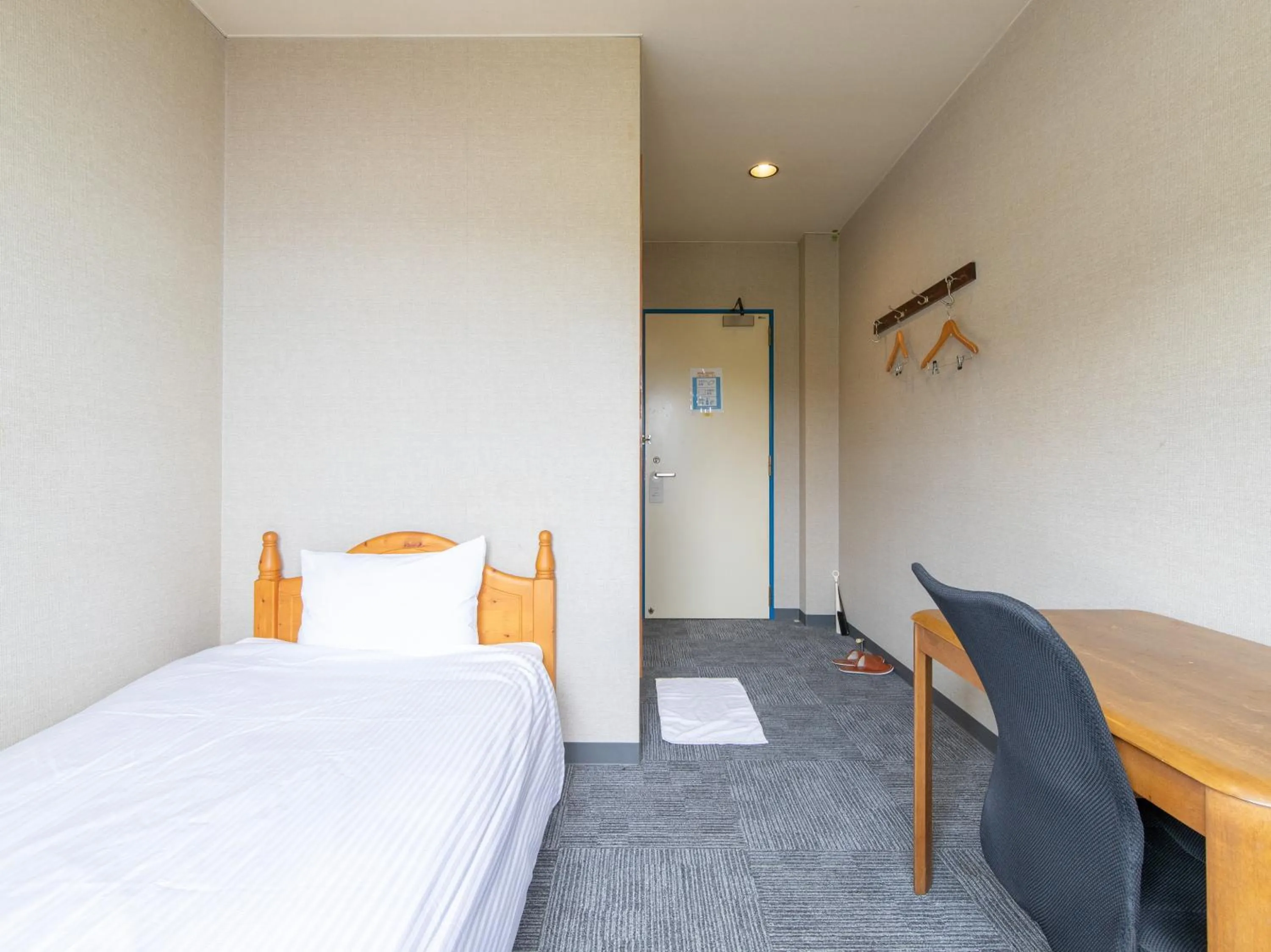 Photo of the whole room, Bed in Tabist Izumi Yusen Shukuhaku Center