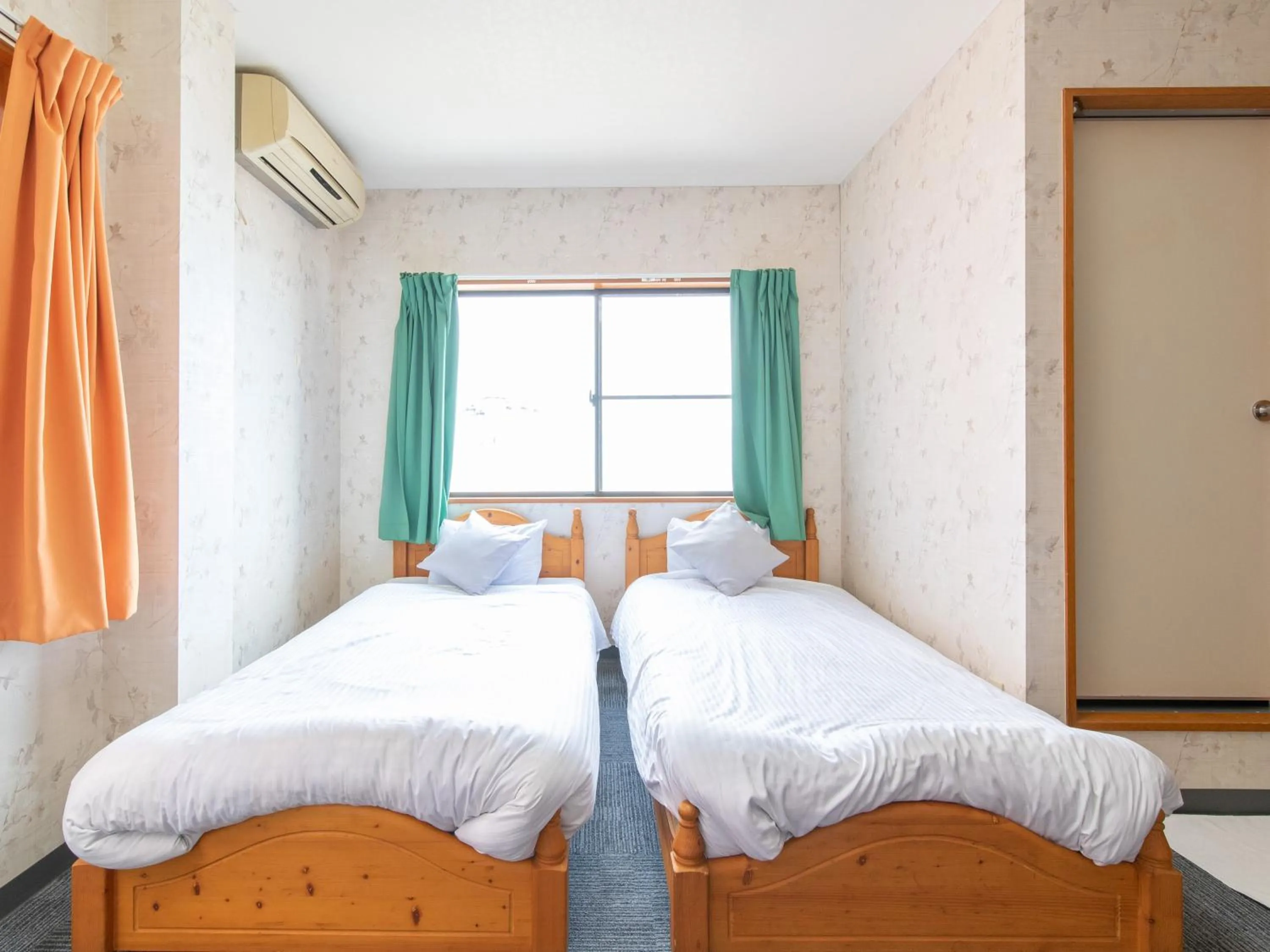 Photo of the whole room, Bed in Tabist Izumi Yusen Shukuhaku Center