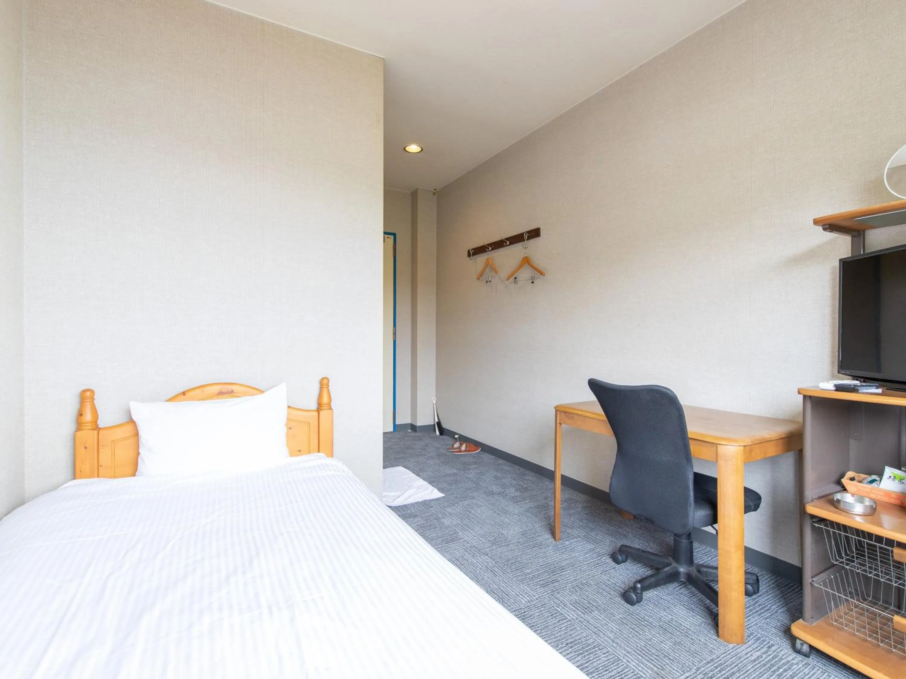 Photo of the whole room, Bed in Tabist Izumi Yusen Shukuhaku Center