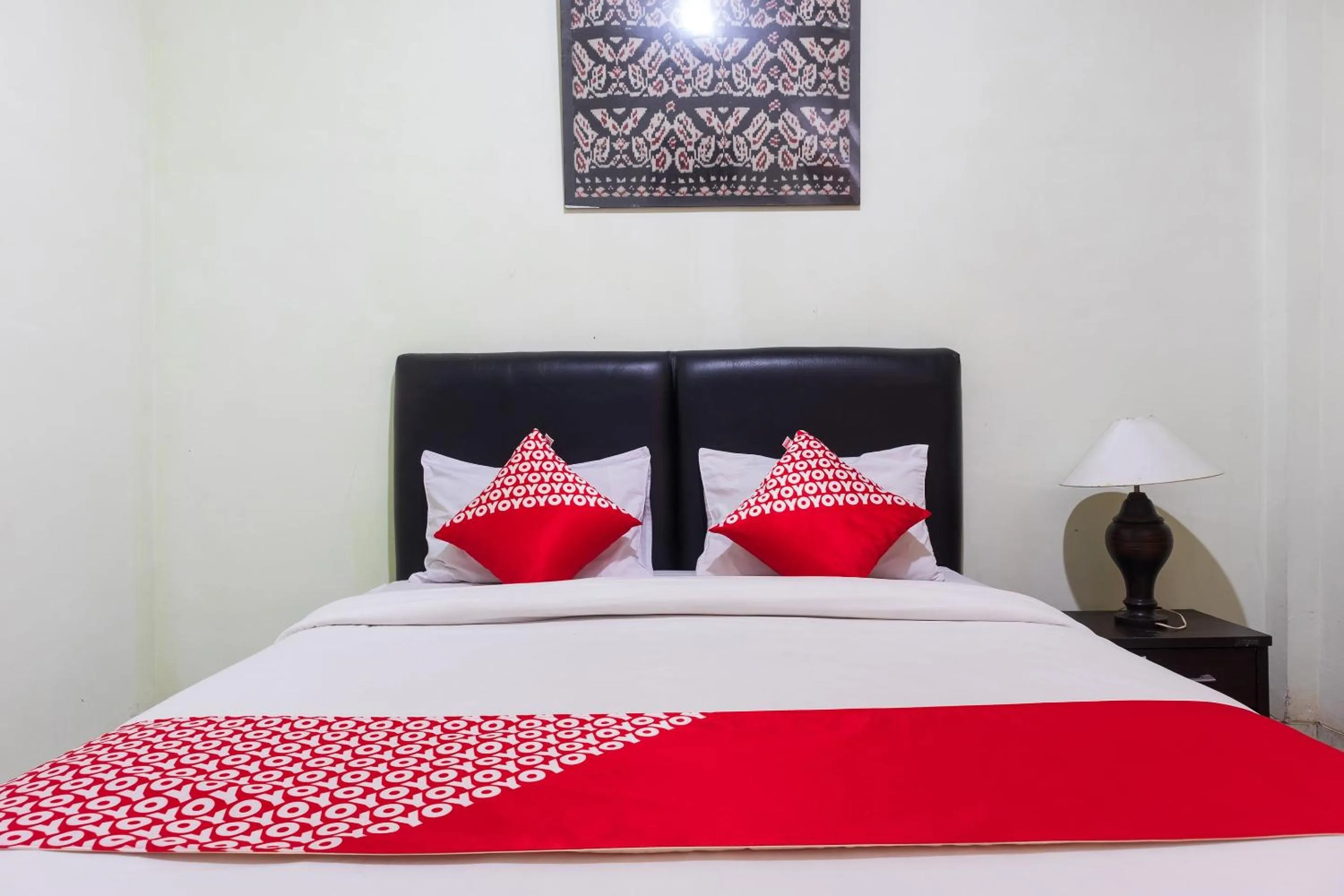 Bedroom in Super OYO 1682 Greenia Hotel