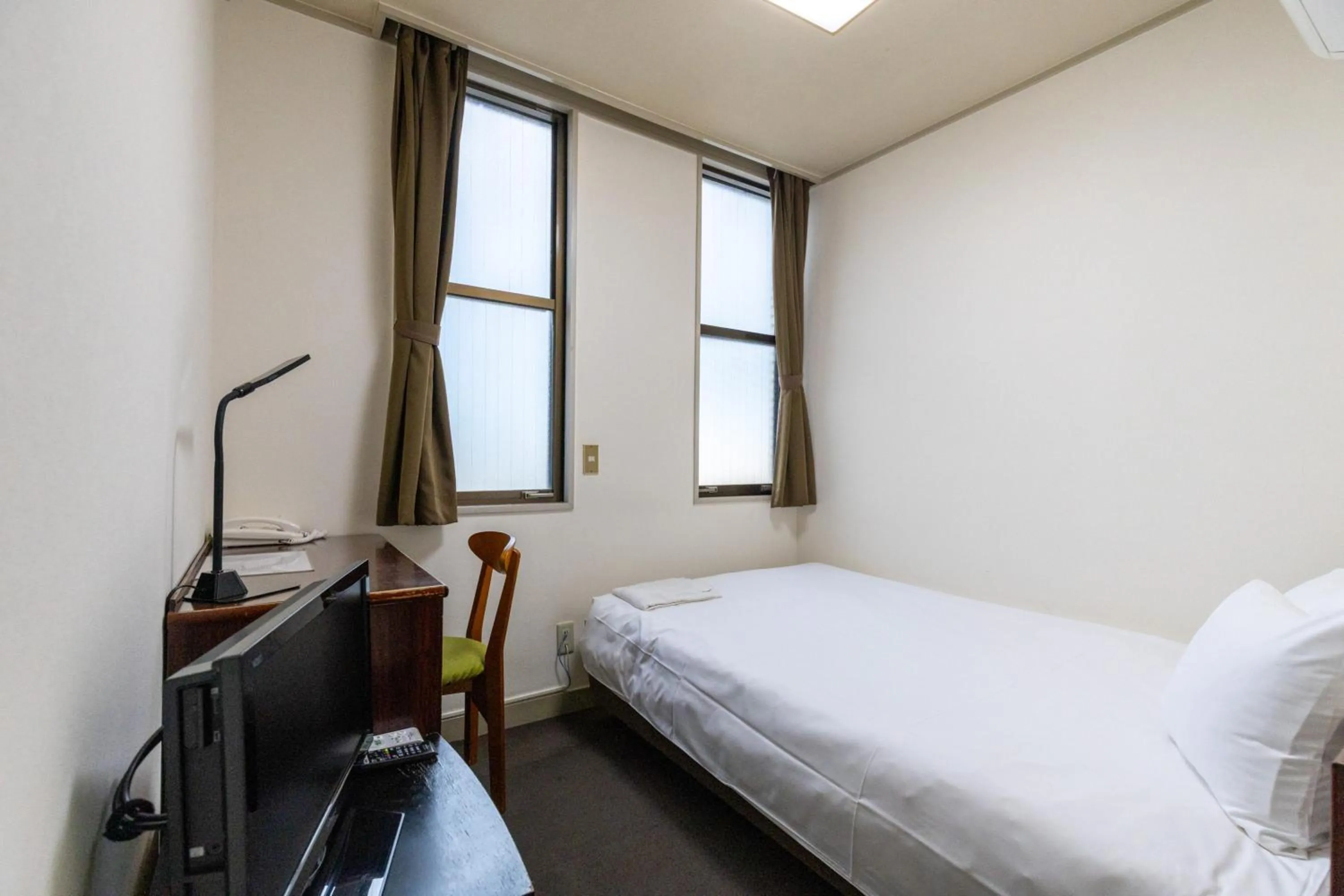 Photo of the whole room, Bed in Tabist Business Hotel Suehiro Matsuyama
