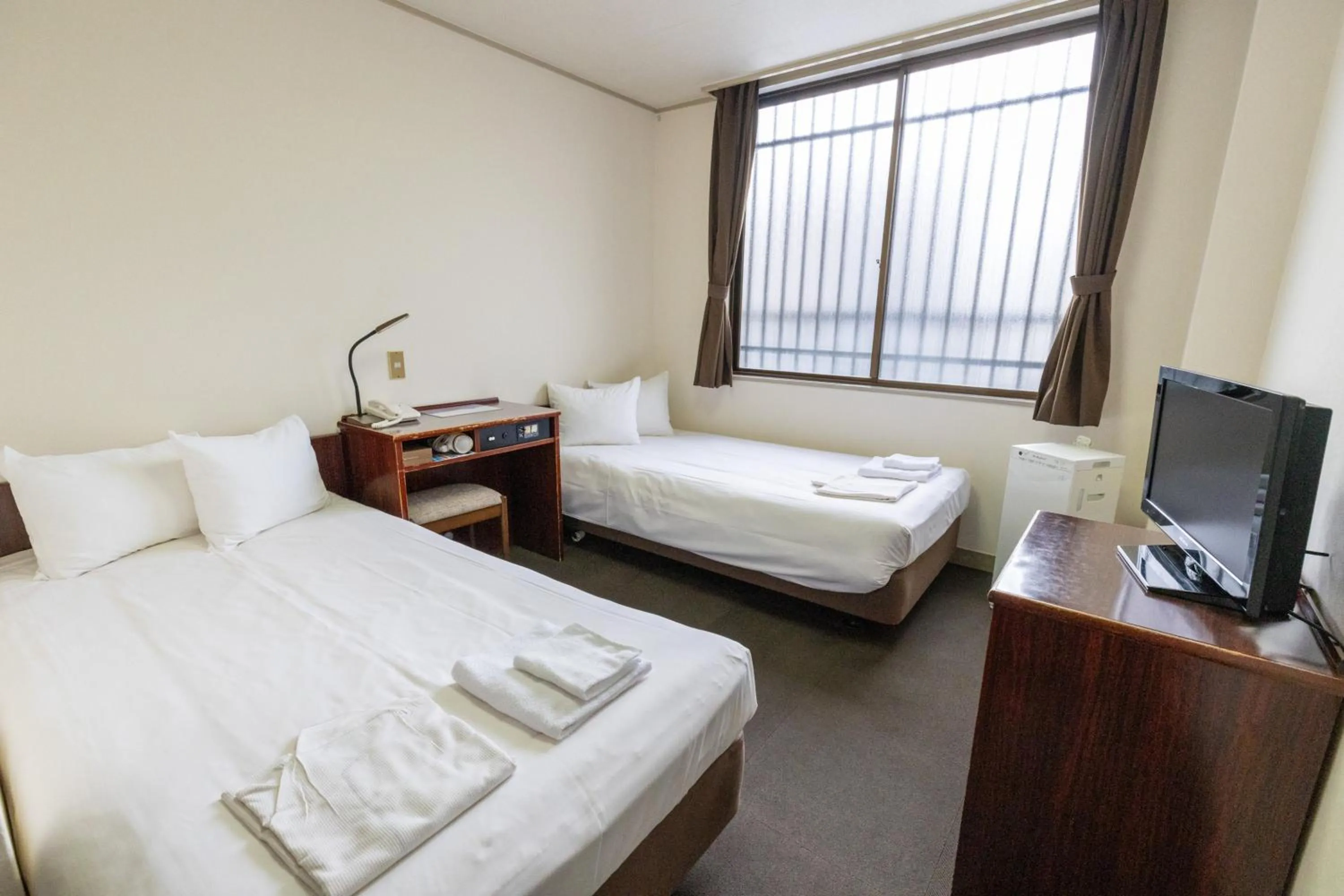 Photo of the whole room, Bed in Tabist Business Hotel Suehiro Matsuyama