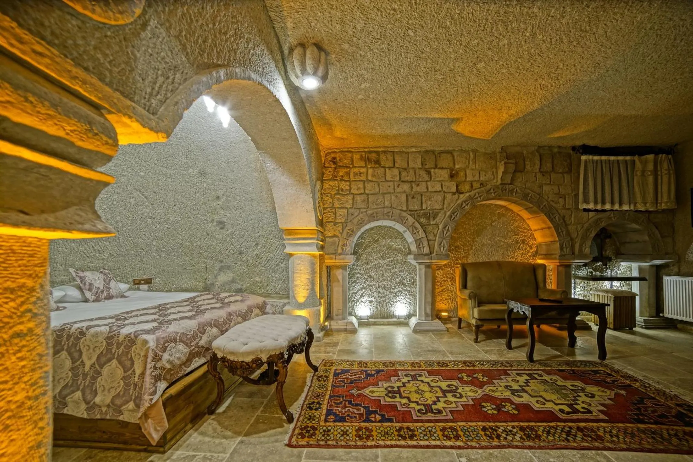 Bed in Risus Cave Suites