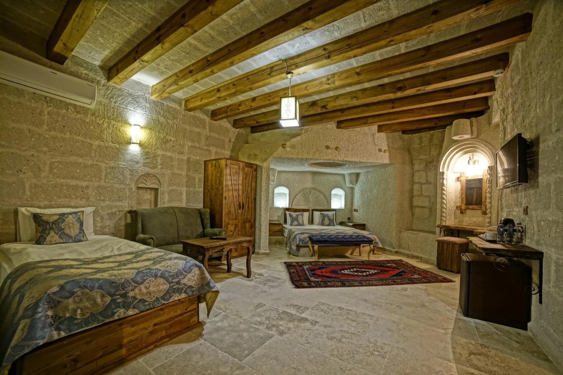 Bed in Risus Cave Suites