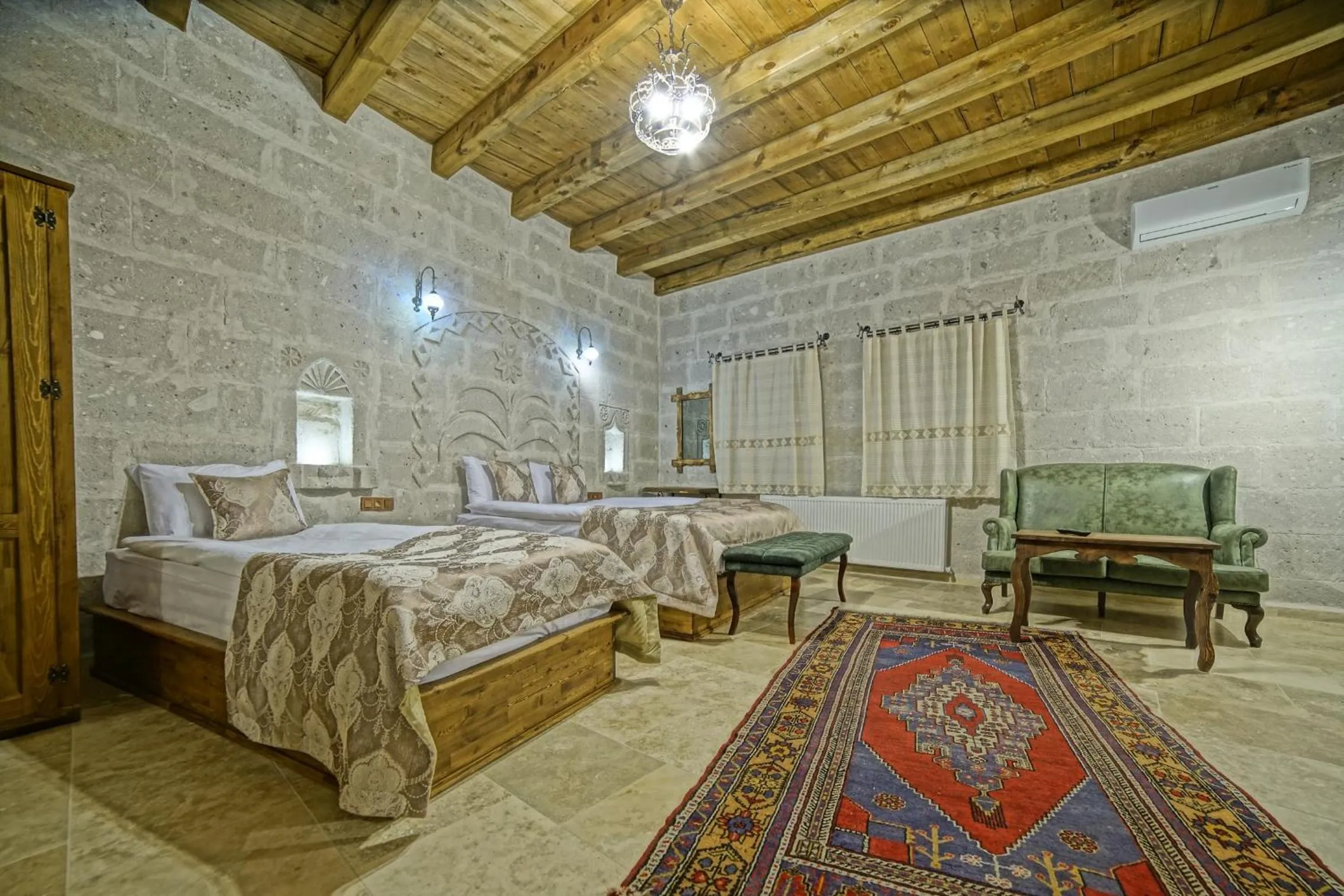 Bed in Risus Cave Suites