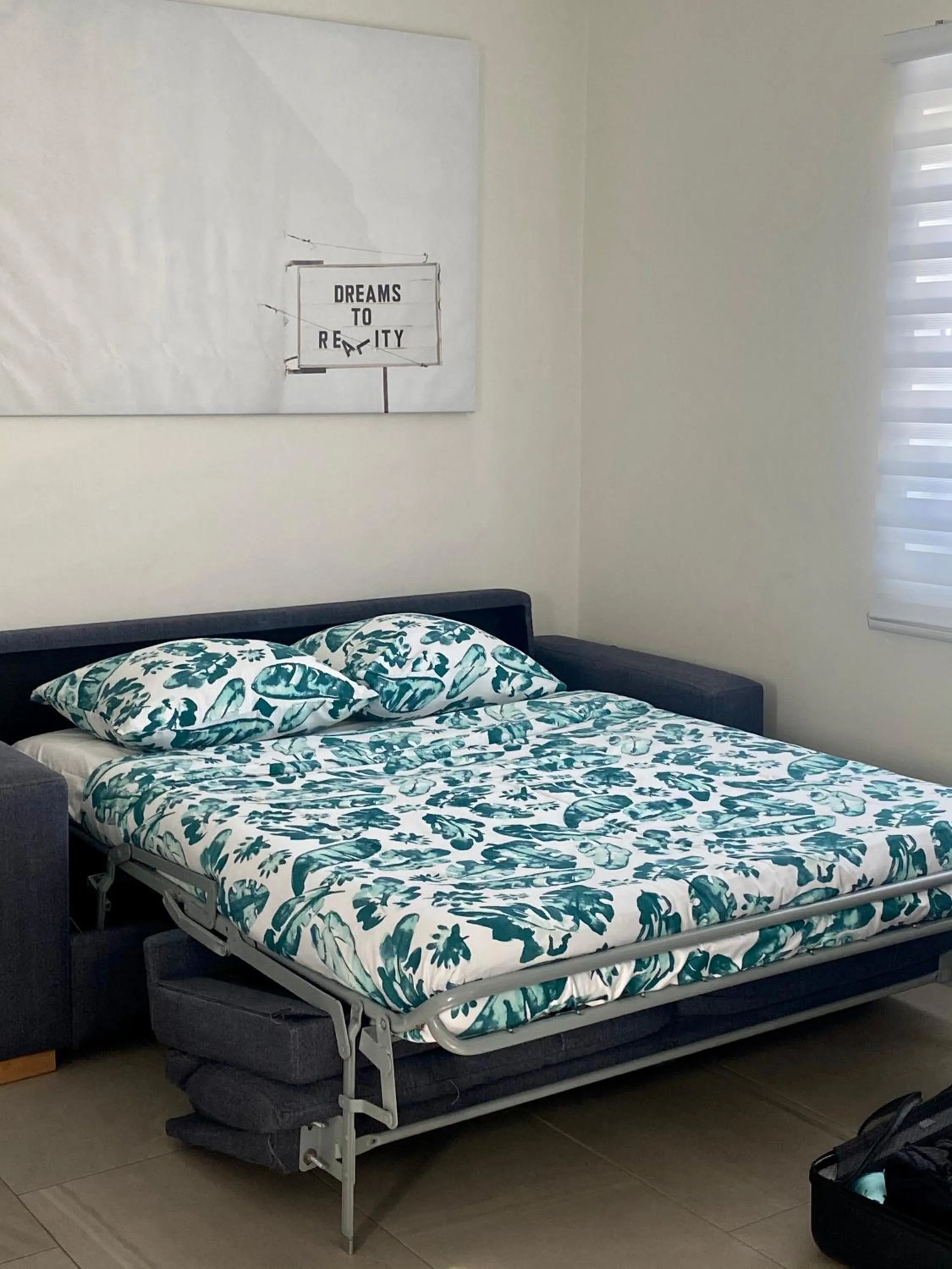 Bed in The Palm Leaf Apartments