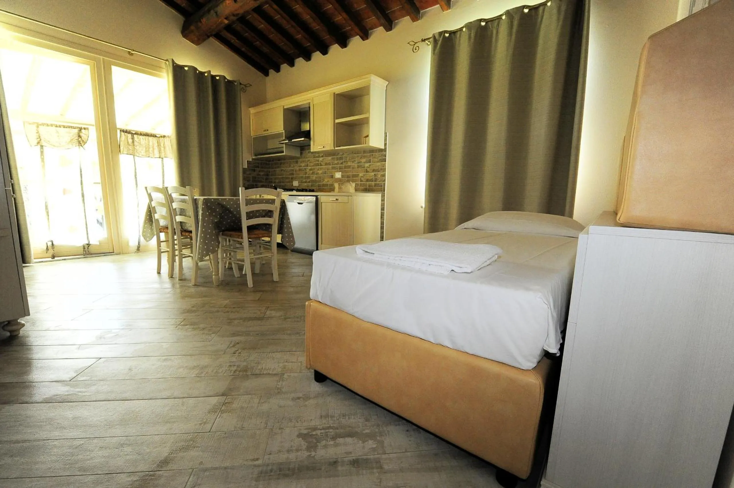Kitchen or kitchenette, Bed in Fattoria Palazzeta - Pet & Family Friendly
