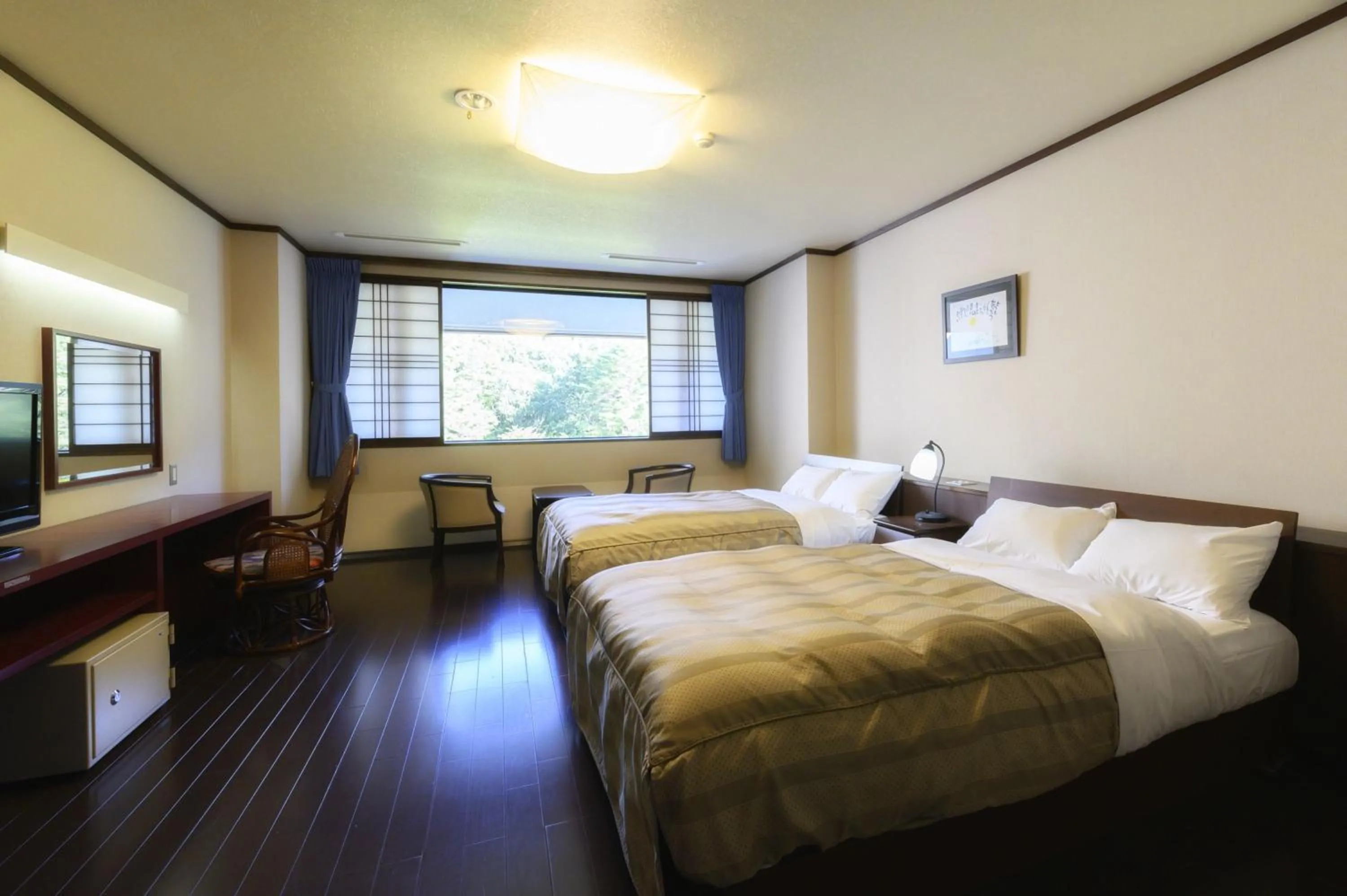 Bed in Takamiya Hotel Bonari no Mori