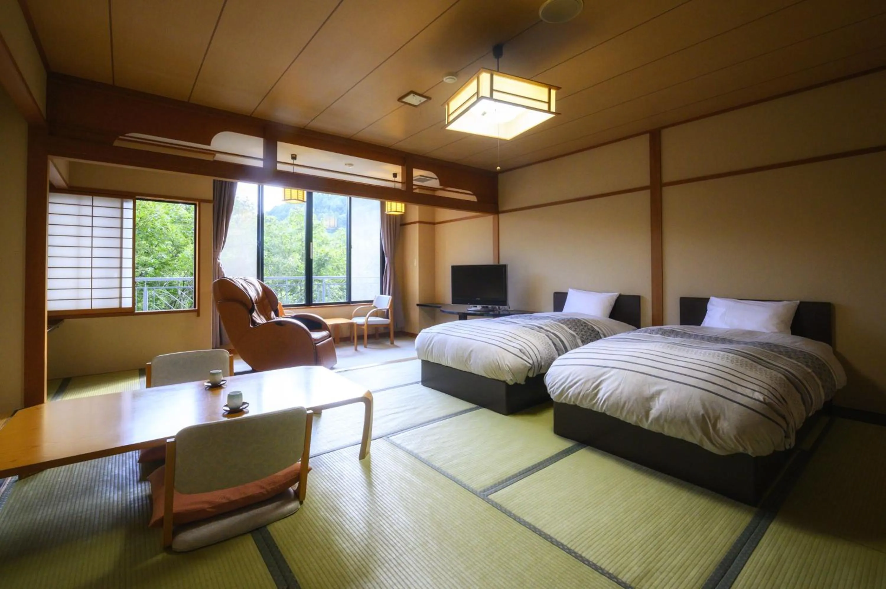 Bed in Takamiya Hotel Bonari no Mori