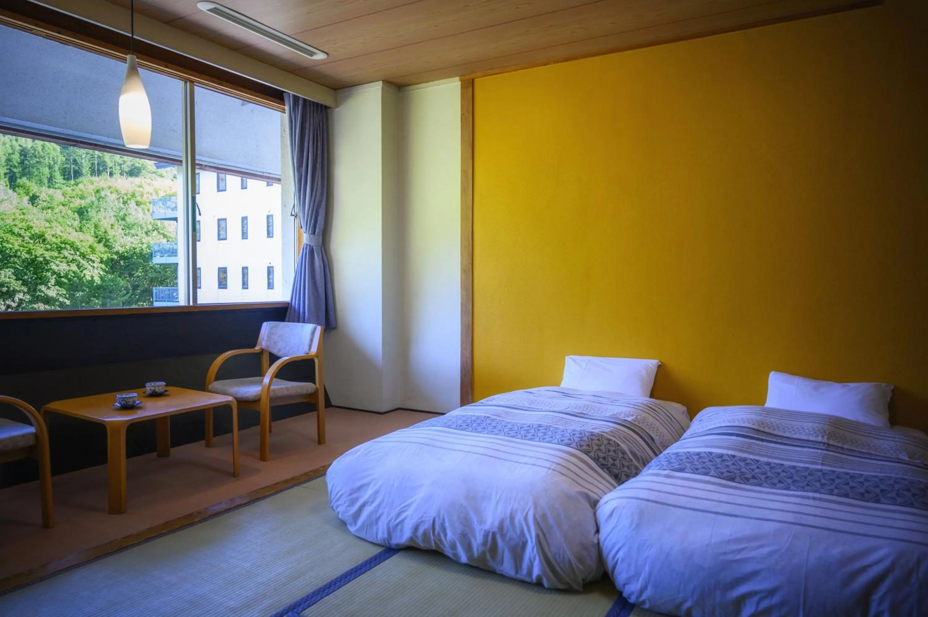 Bed in Takamiya Hotel Bonari no Mori