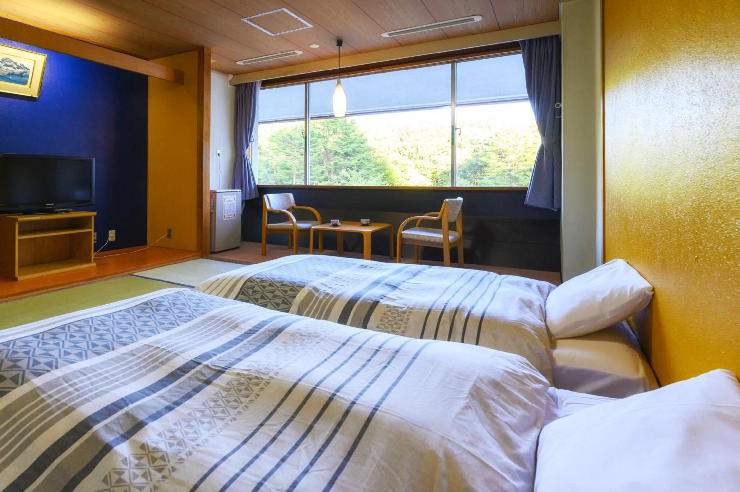 Bed in Takamiya Hotel Bonari no Mori