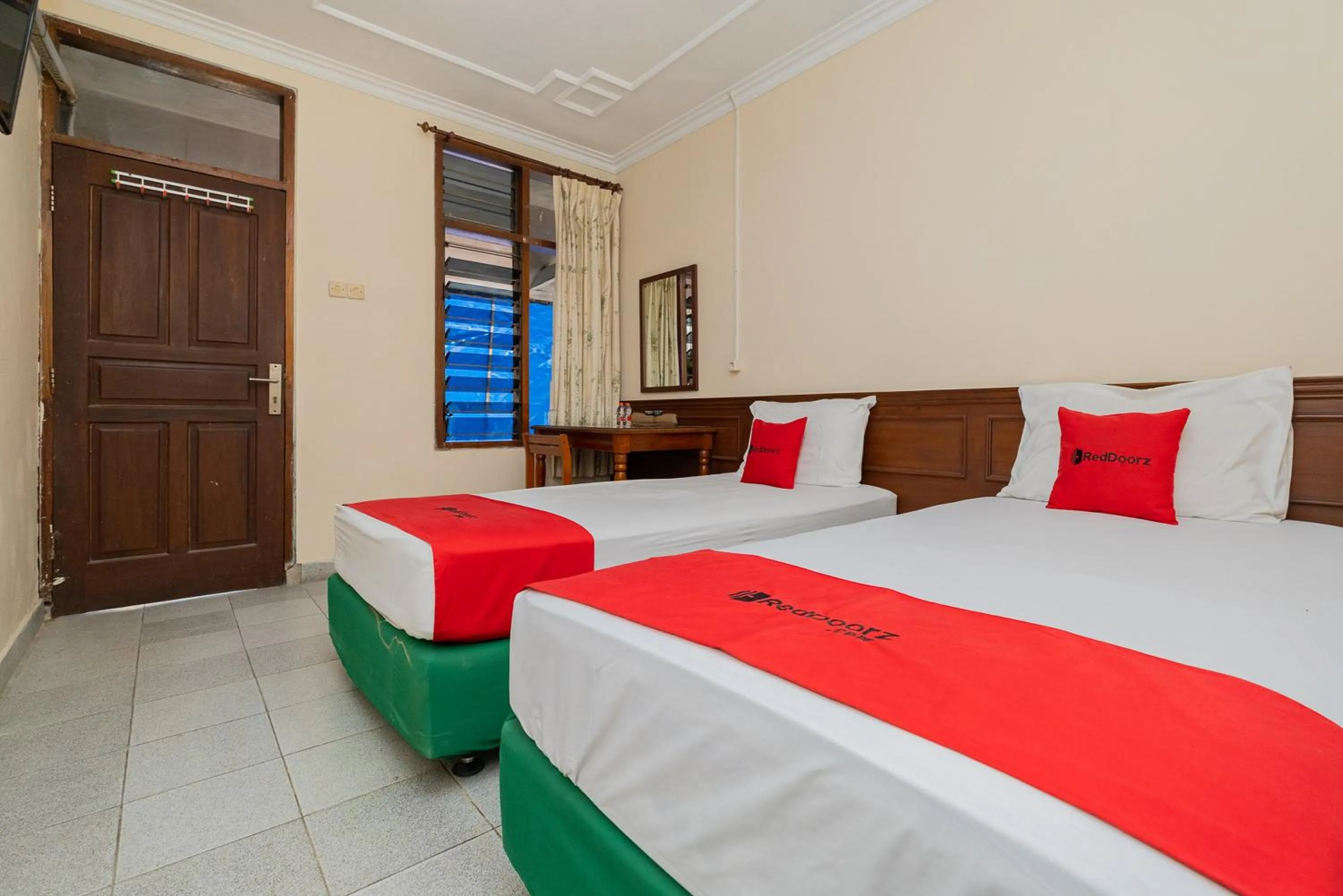 Bed in RedDoorz near Bojonegoro Train Station