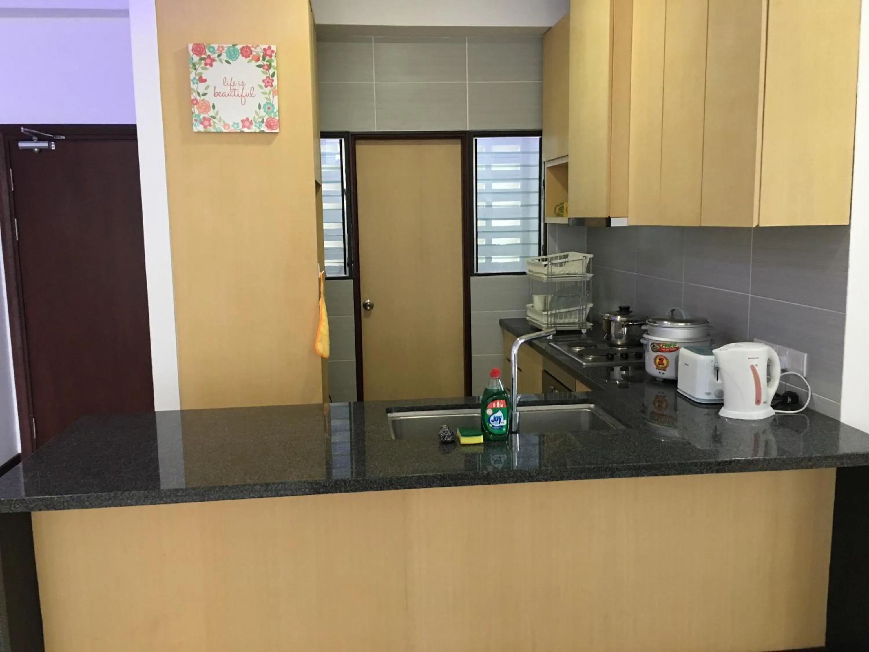 Kitchen or kitchenette in Imperial Suites at Boulevard Mall