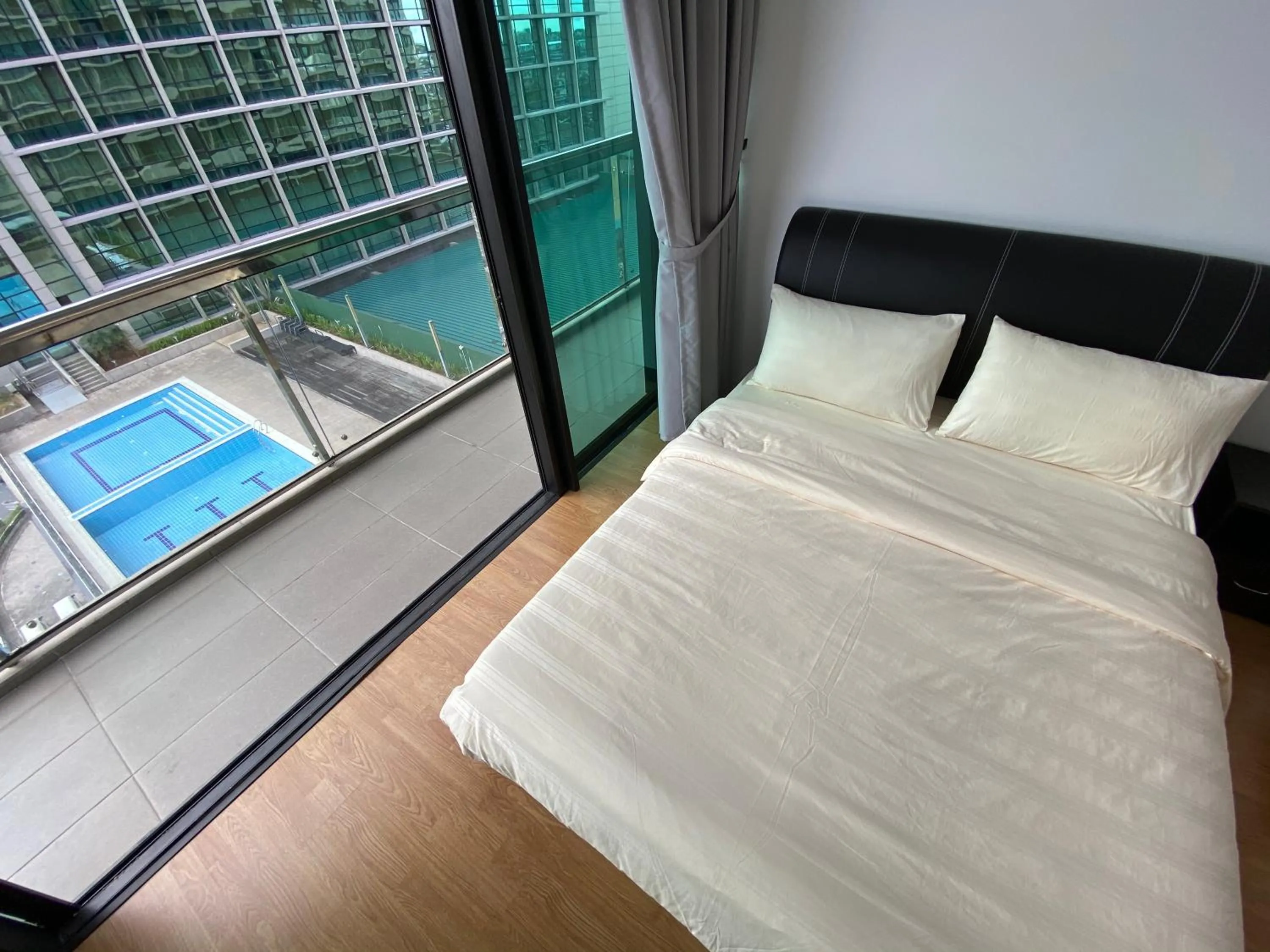 Pool view, Bed in Imperial Suites at Boulevard Mall