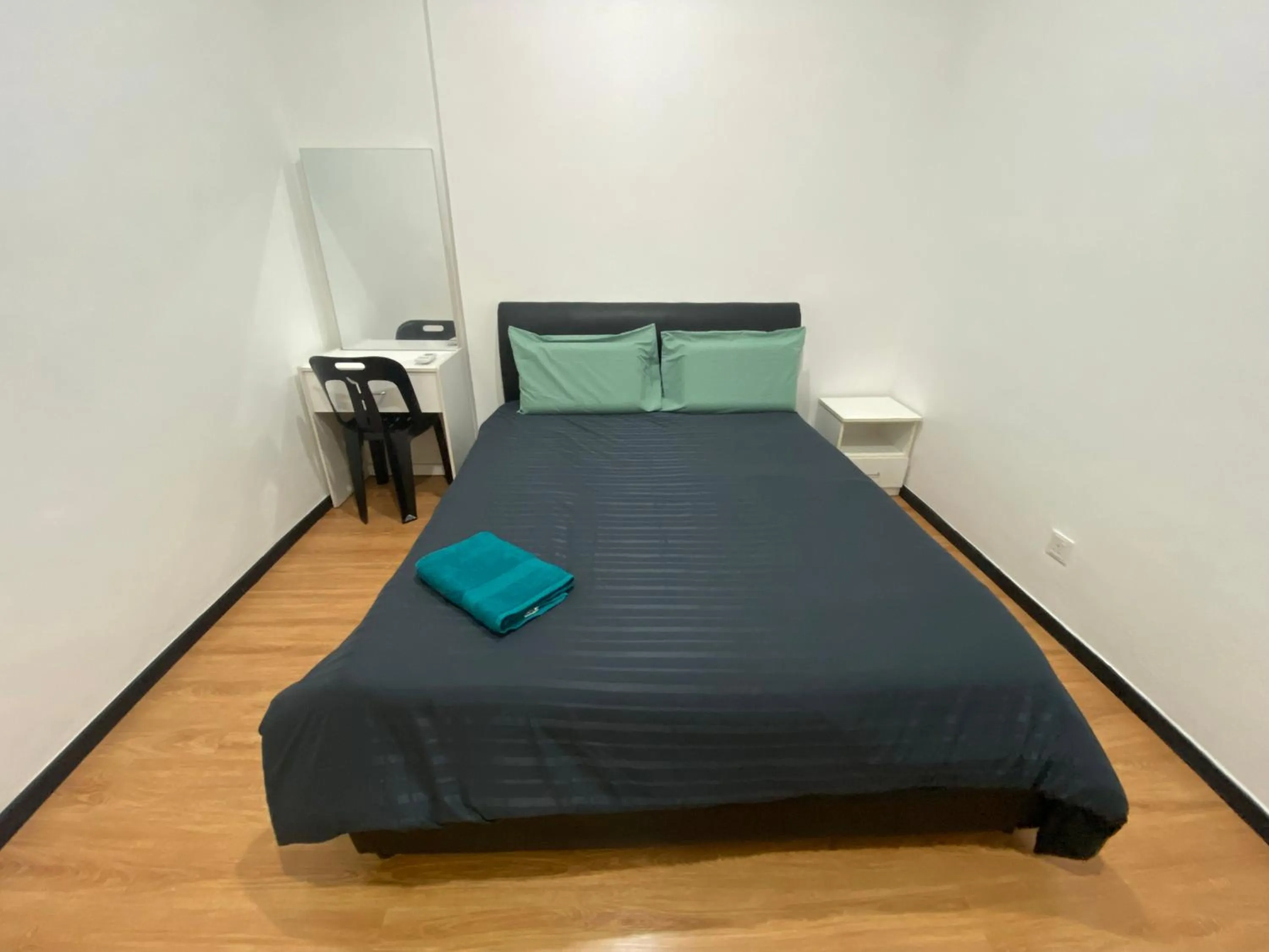 Bed in Imperial Suites at Boulevard Mall