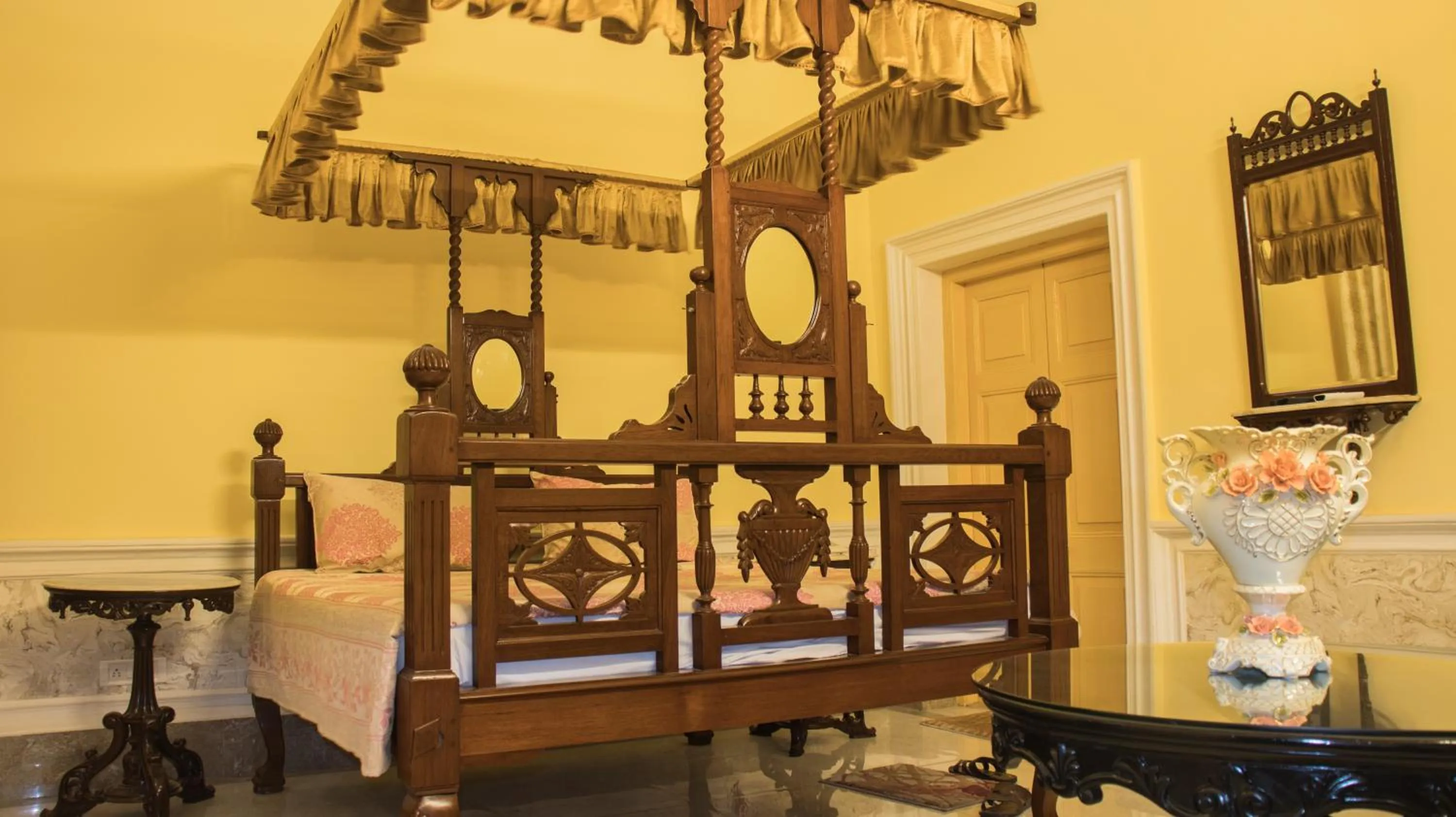 Bed in COSSIMBAZAR PALACE OF THE ROYS ( RAJBARI)