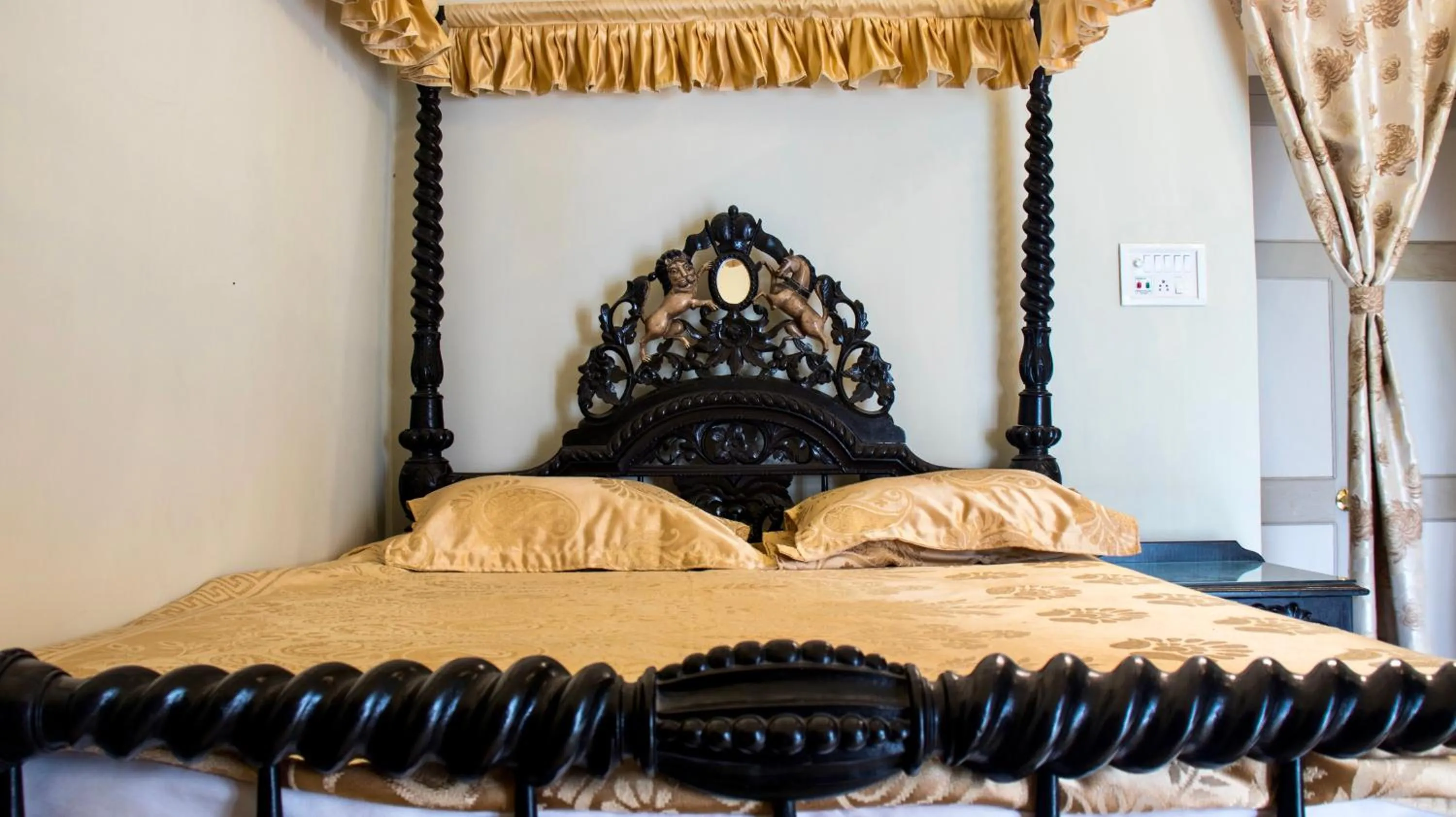 Bed in COSSIMBAZAR PALACE OF THE ROYS ( RAJBARI)
