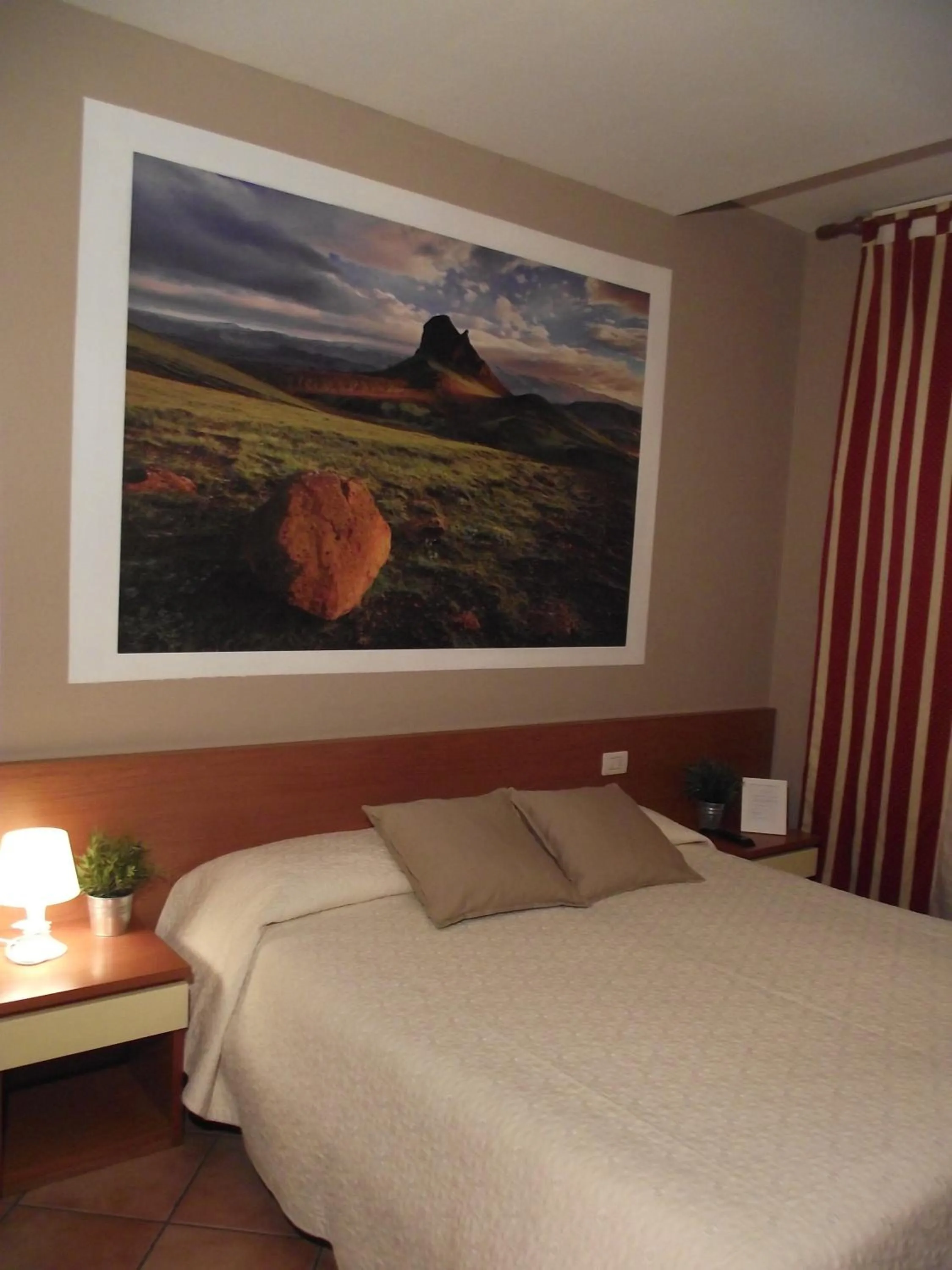 Bedroom in La Corte Albergo