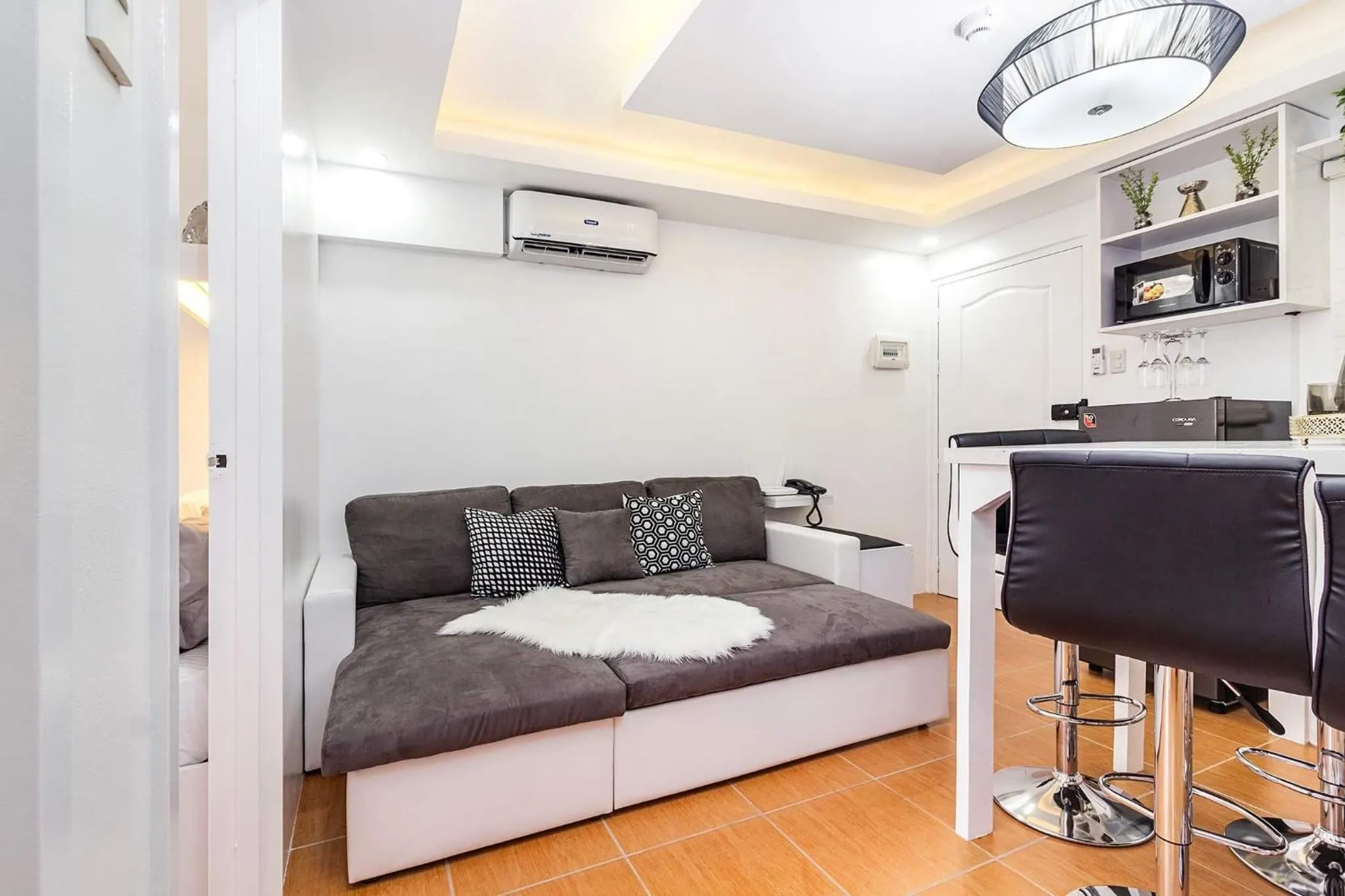 Living room, Bed in Evania by J&J Homes 2BR Unit At One Oasis Cebu