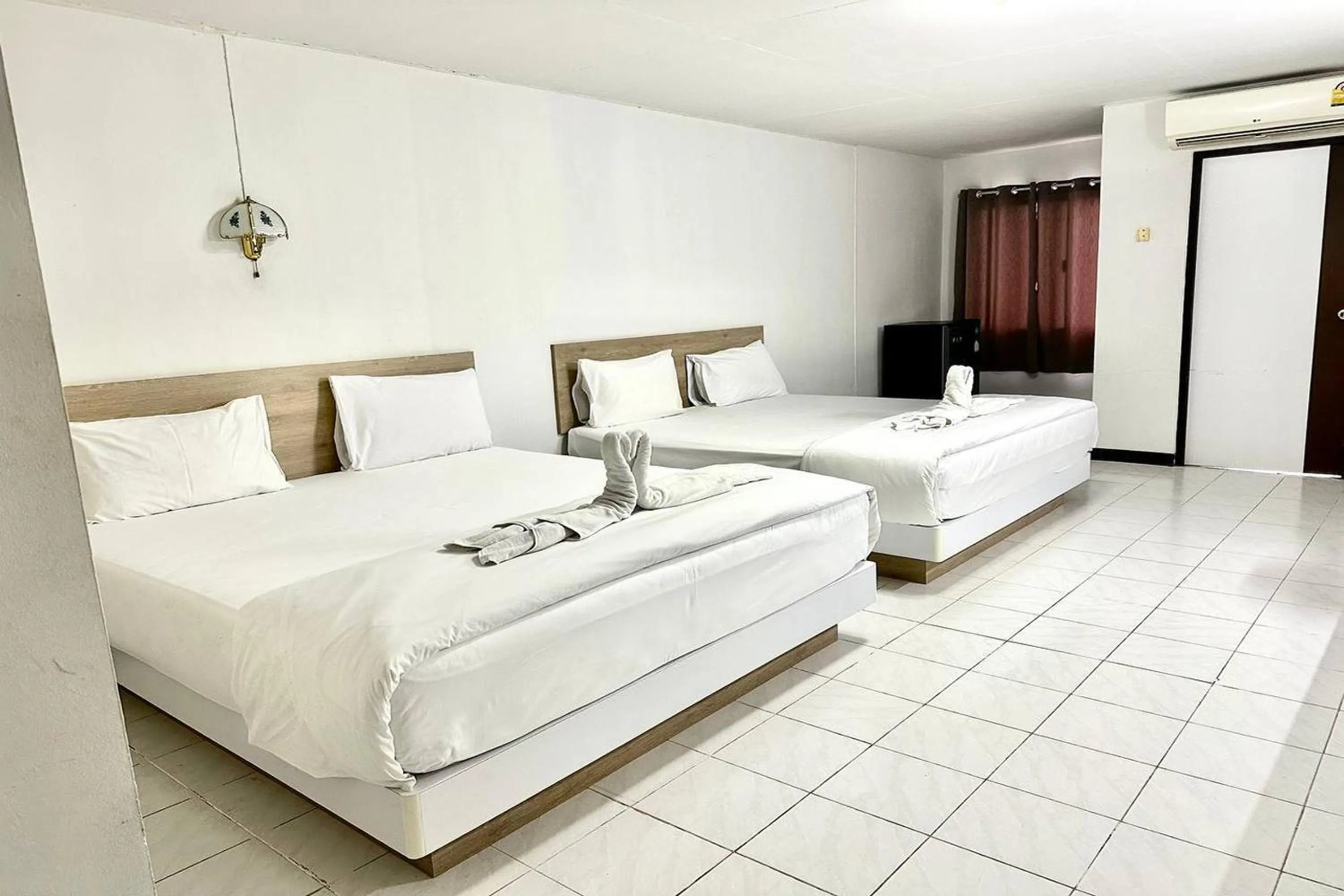 Bed in Boonchai Mansion