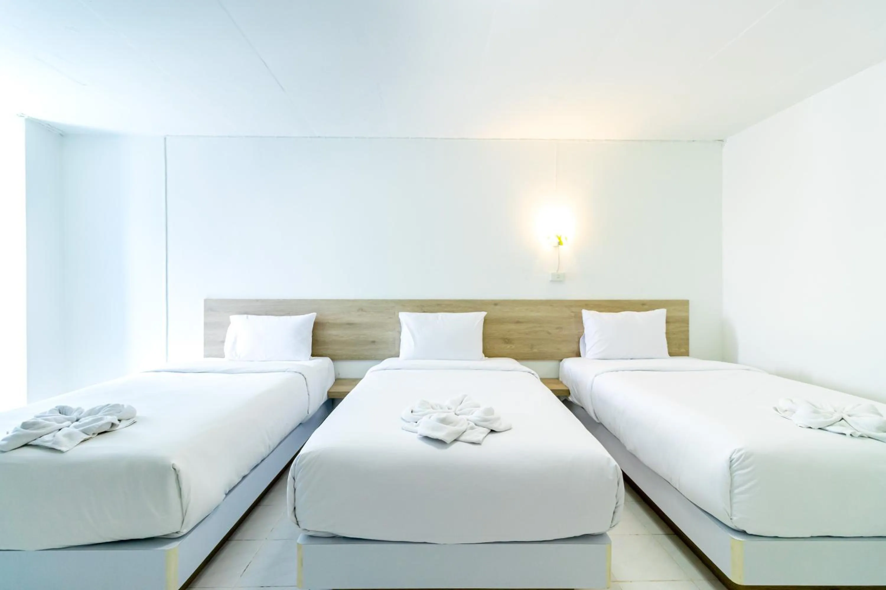 Bed in Boonchai Mansion