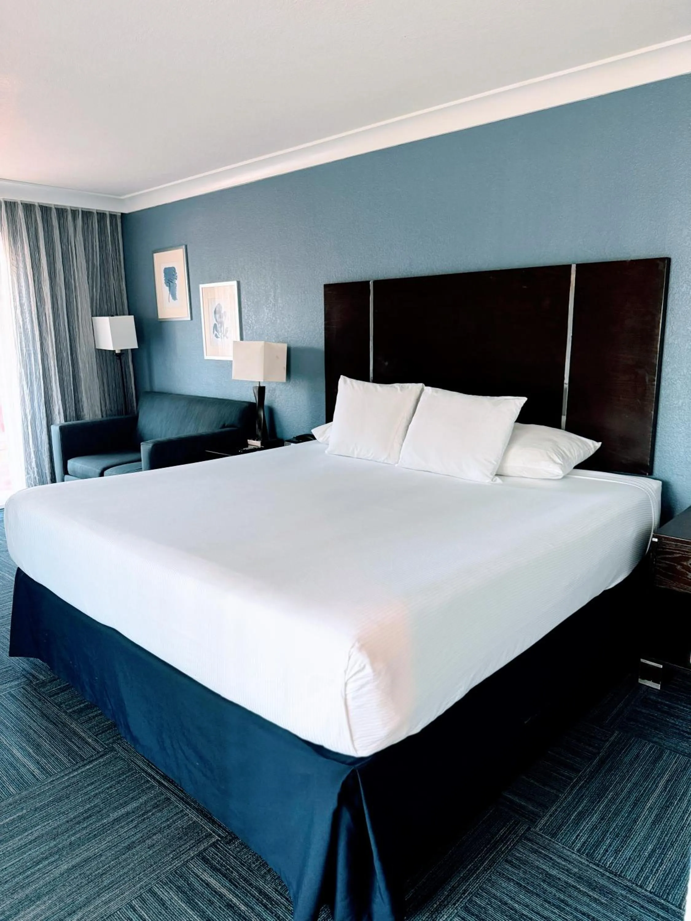 Bed in The Pacific Inn