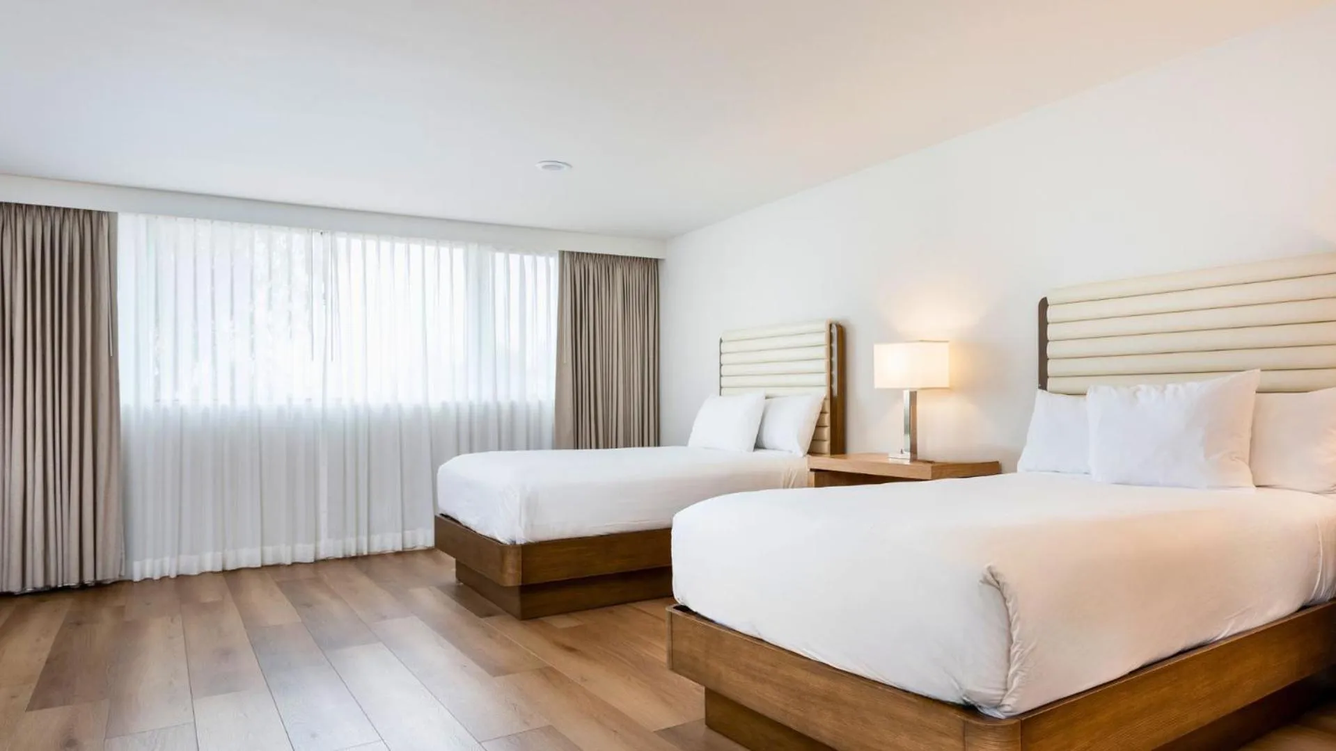 Superior Two Double Beds in Luxe Sunset Boulevard Hotel