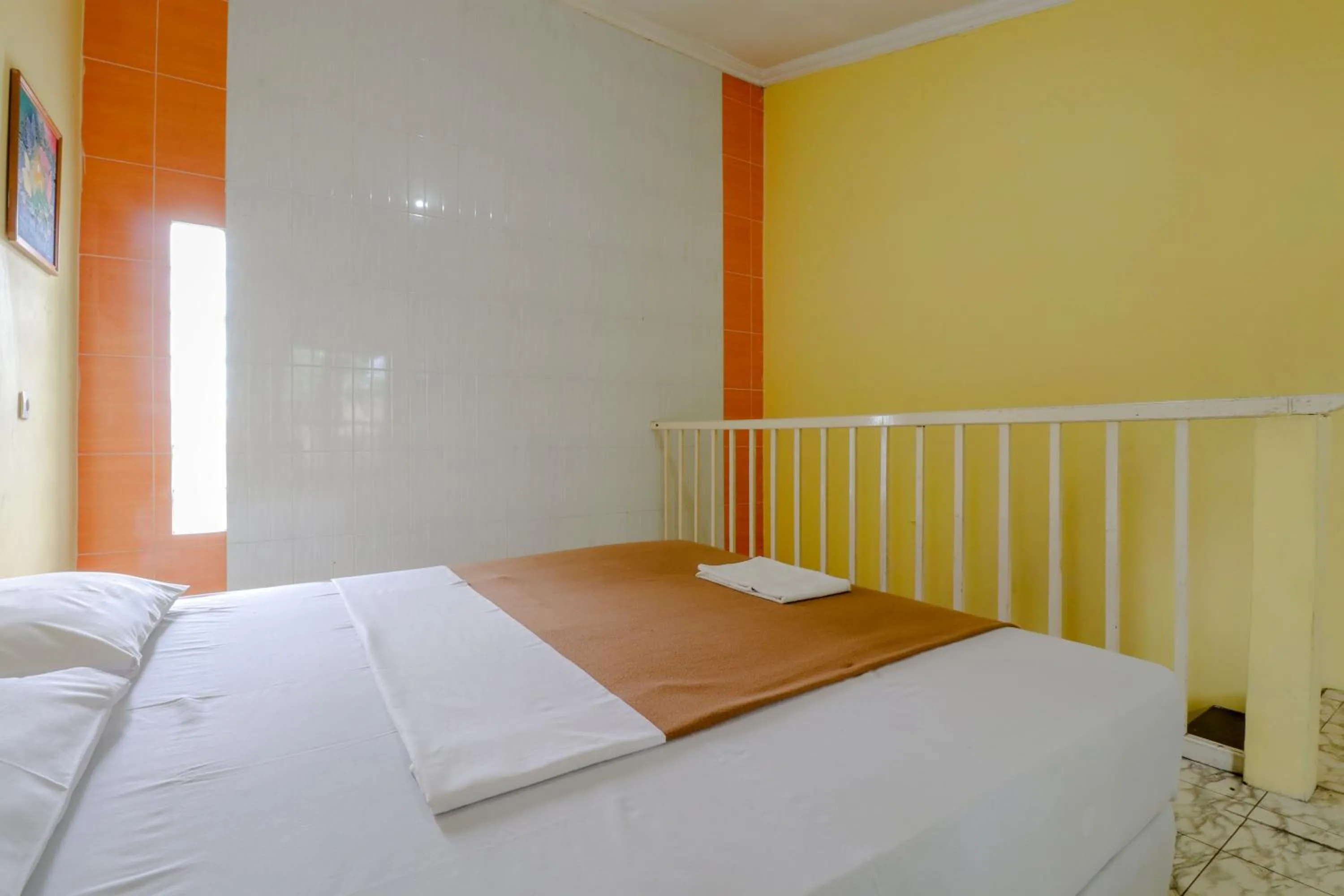 Bed in Hotel Kayu Manis