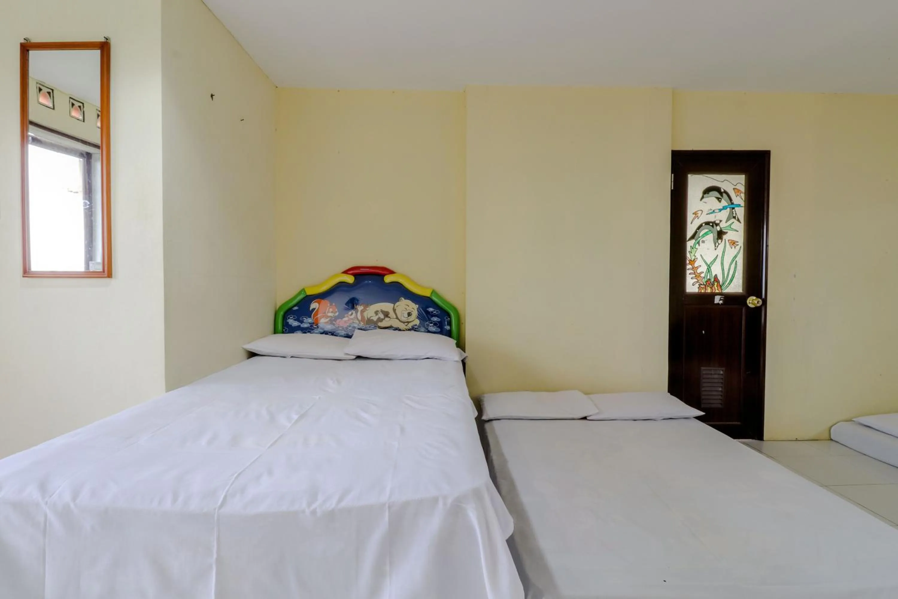 Bed in Hotel Kayu Manis