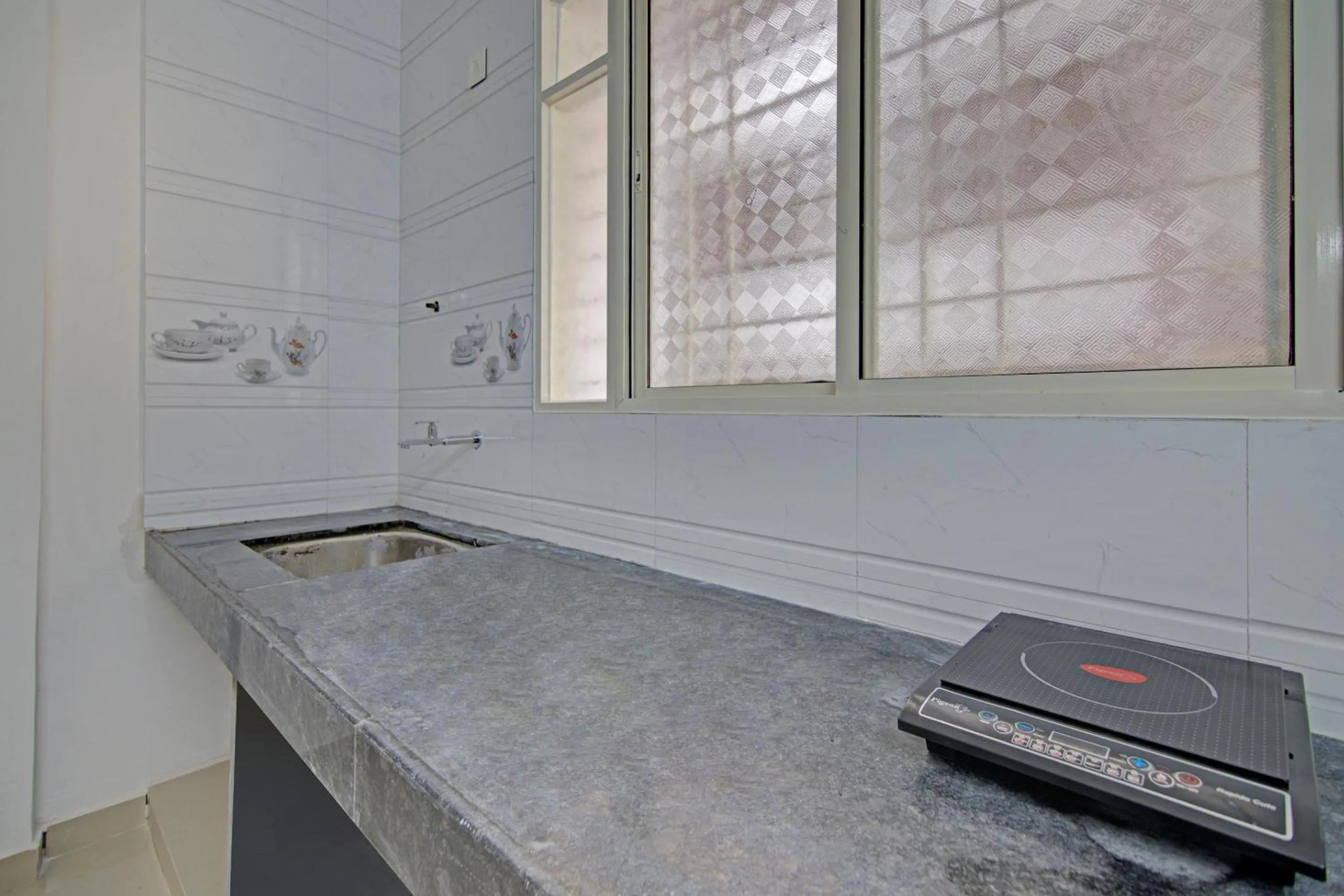 Kitchen or kitchenette in Super Hotel O Home Elegant RK Fursungi