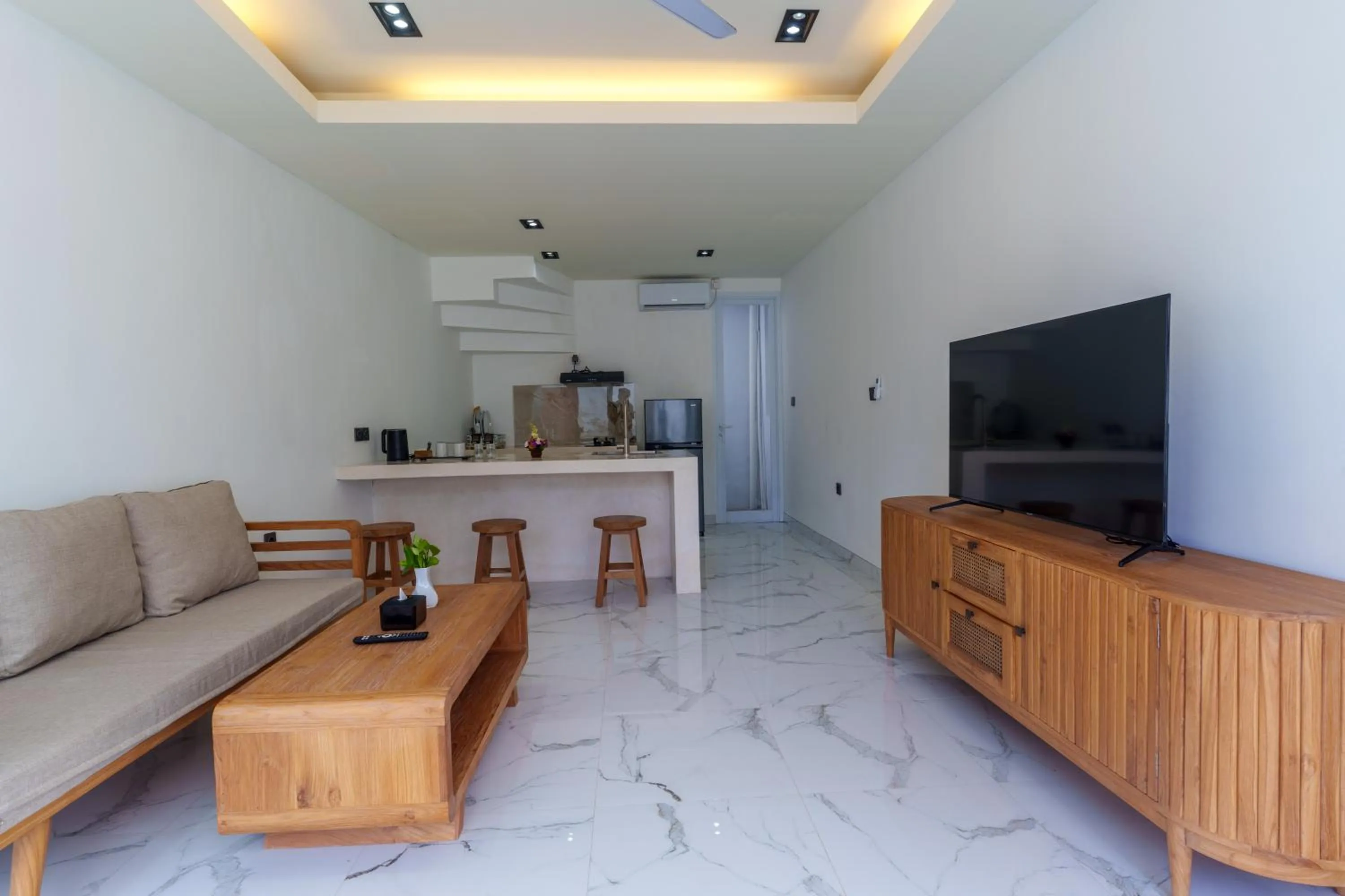 Communal lounge/ TV room in The Capital Hotel and Resort Seminyak