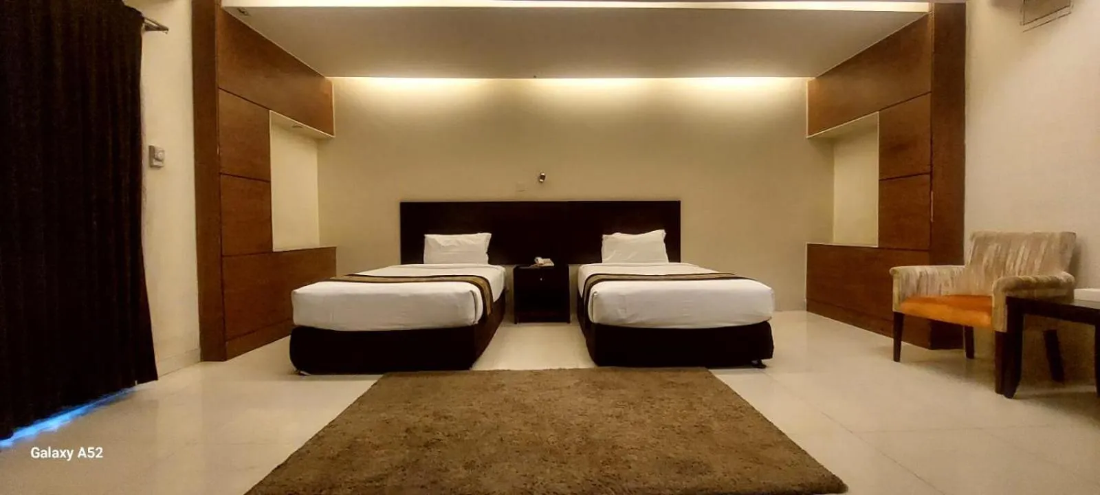 Bed in The Avenue Hotel & Suites