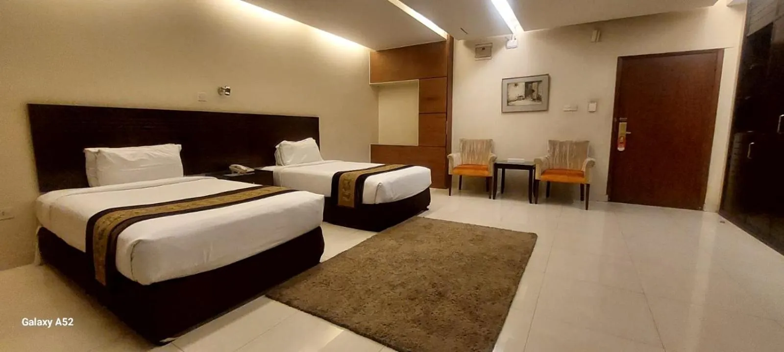 Bed in The Avenue Hotel & Suites