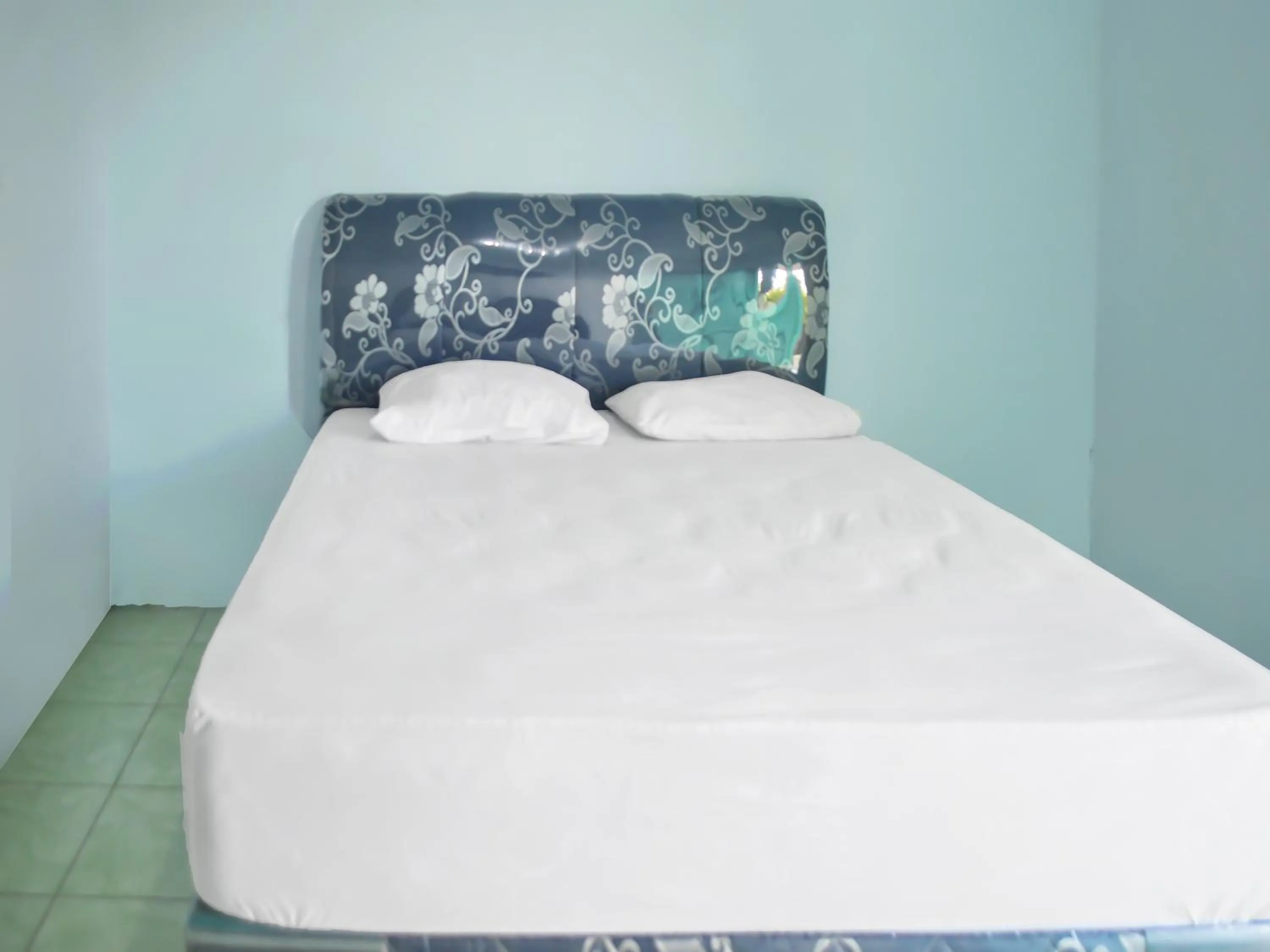 Bedroom in OYO 1745 Guest House Nur Aziziah Syariah 2