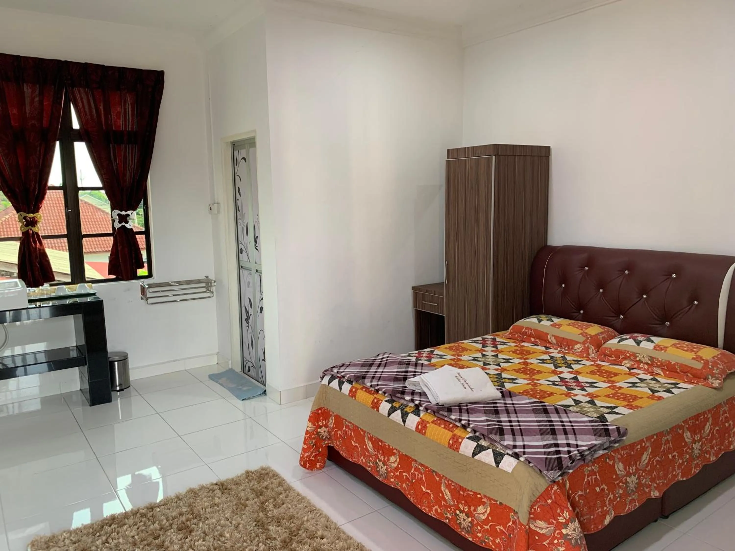 Bed in Wan Danisha Villa Inn