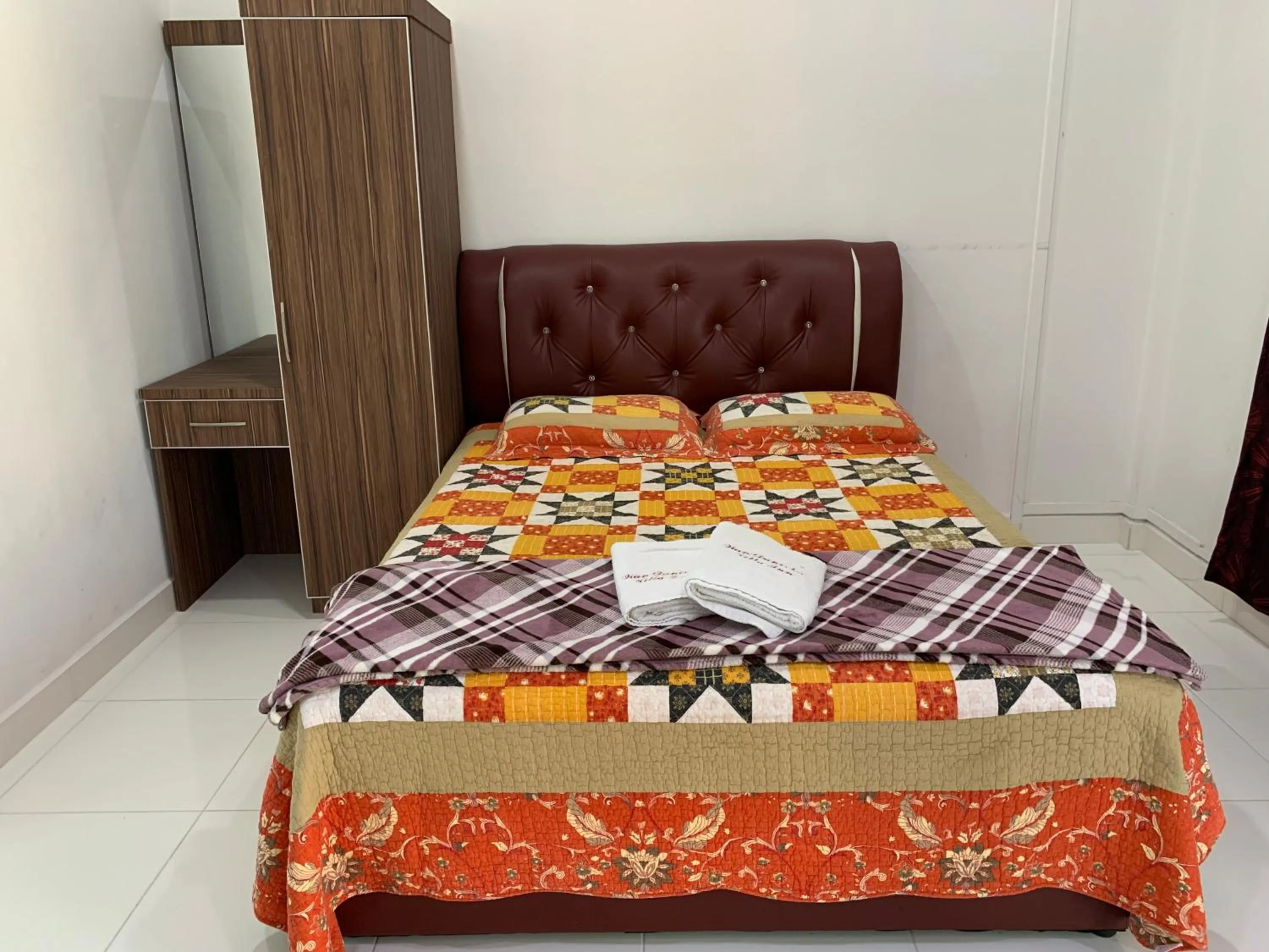 Bed in Wan Danisha Villa Inn