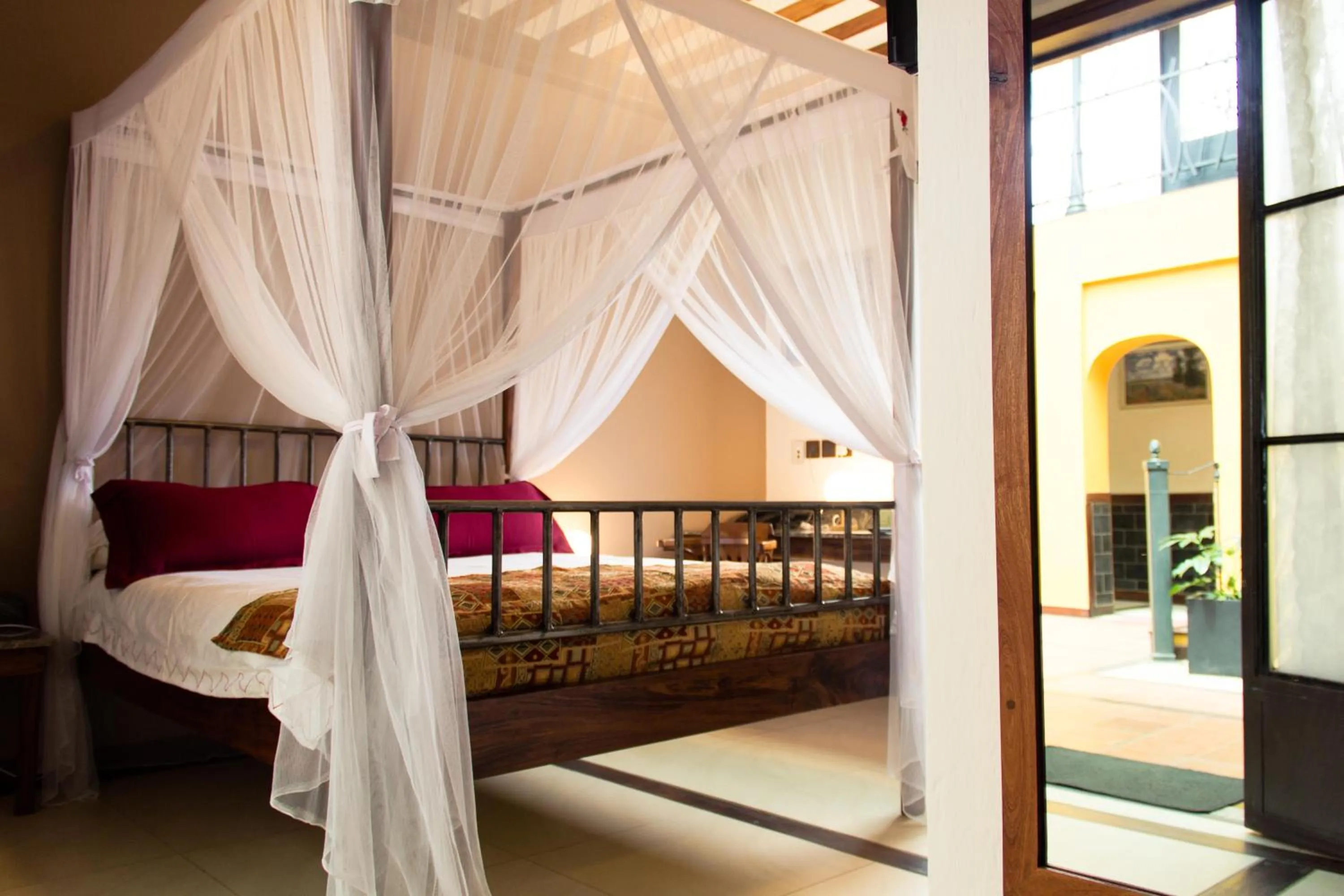 Bed in Hotel Bougainviller