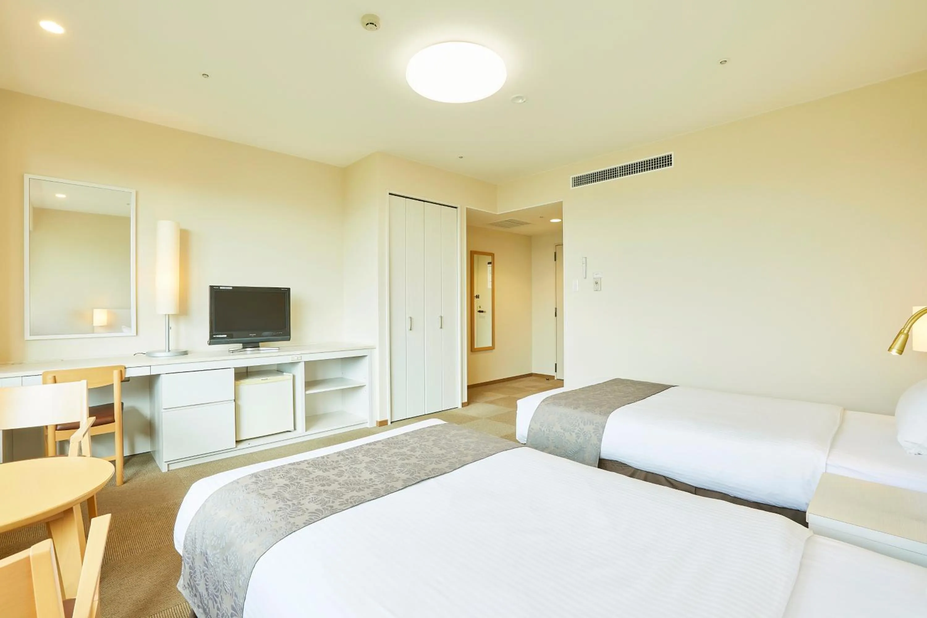 Bed in KAMENOI HOTEL Fukui