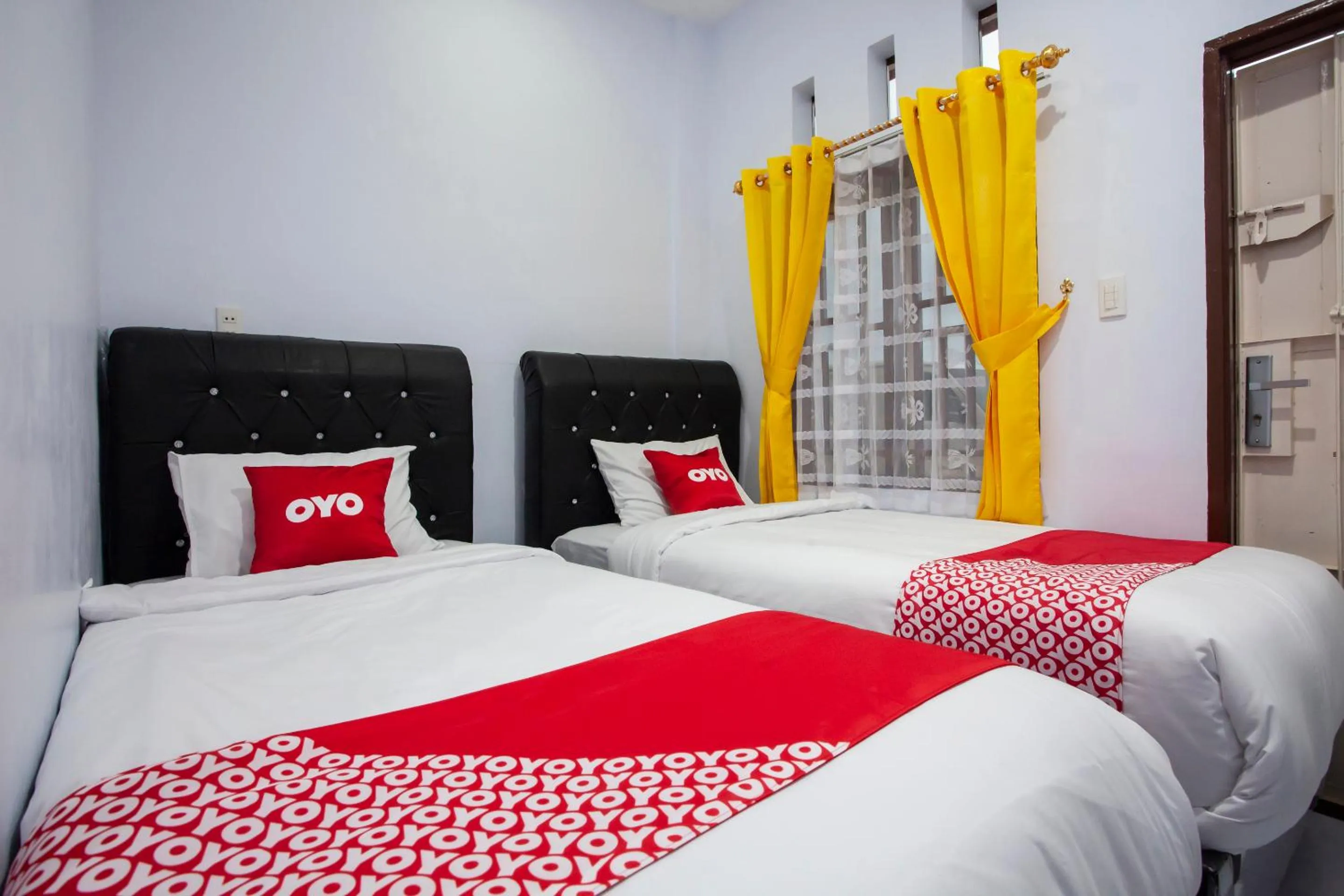 Bedroom in OYO 1764 Sopou Penginapan Rinal & Tuah