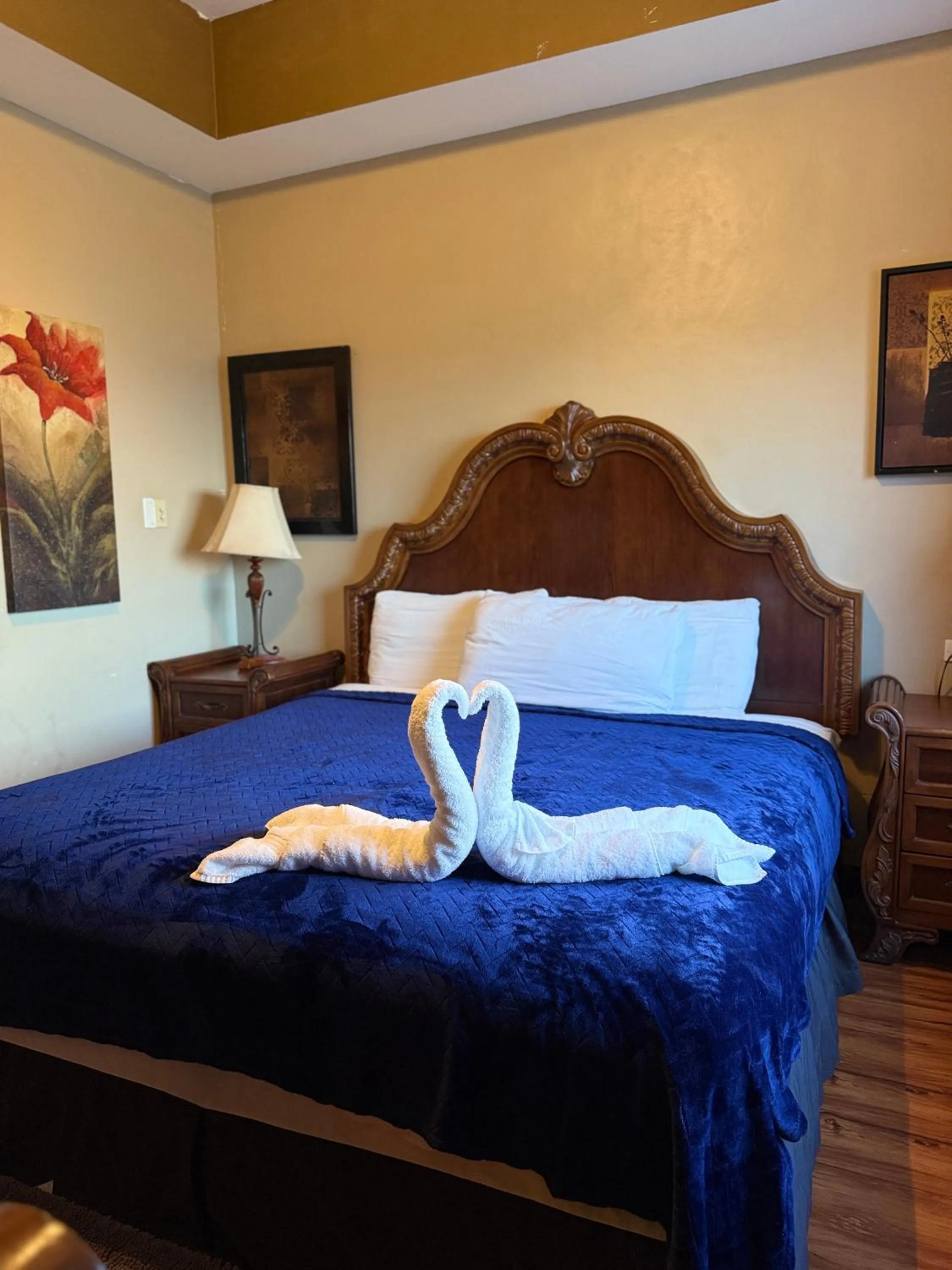 Bed in Hotel Royal Blue & Golf Cart Rental