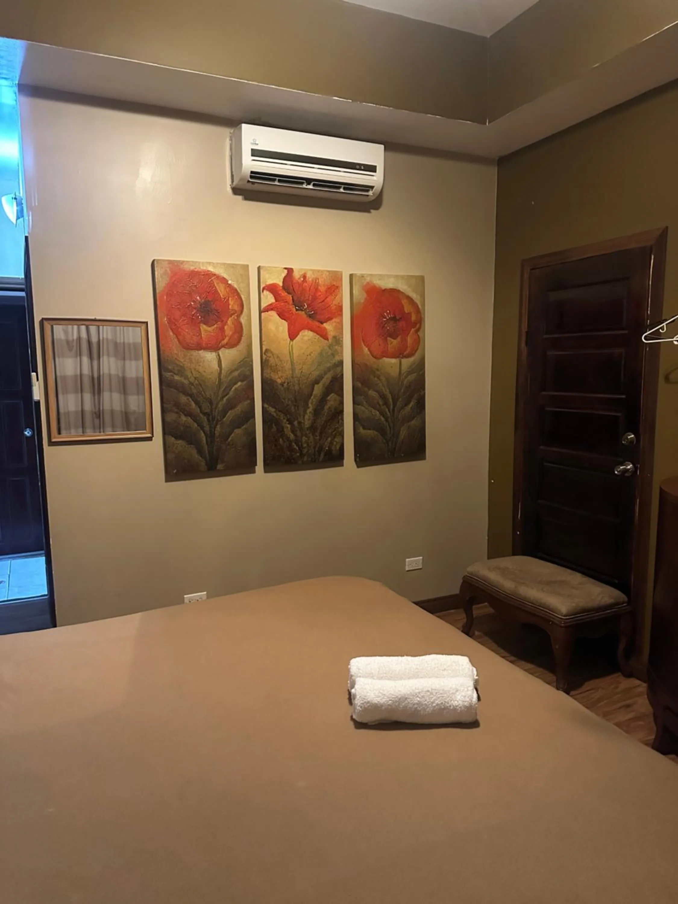 Bed in Hotel Royal Blue & Golf Cart Rental