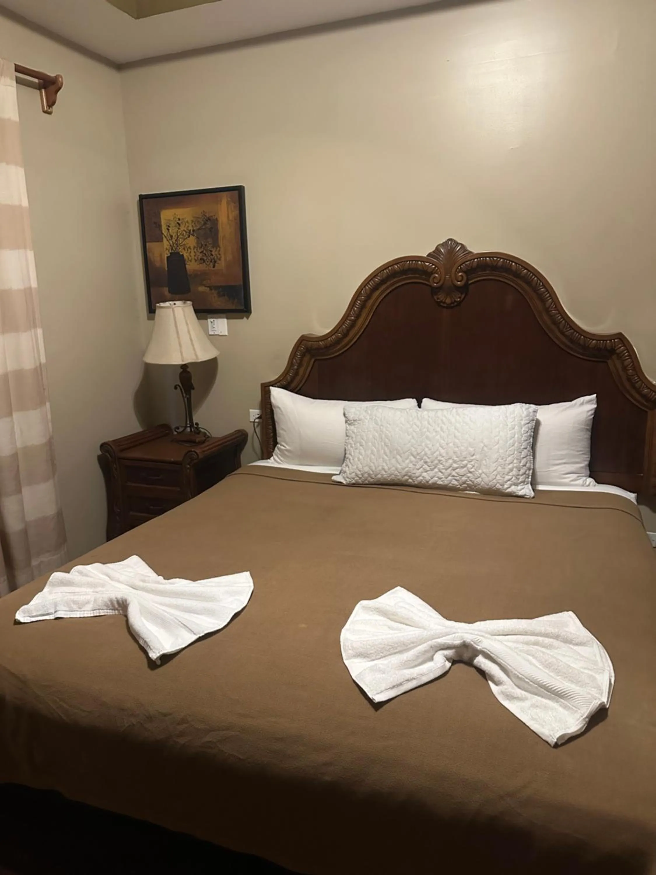 Bed in Hotel Royal Blue & Golf Cart Rental