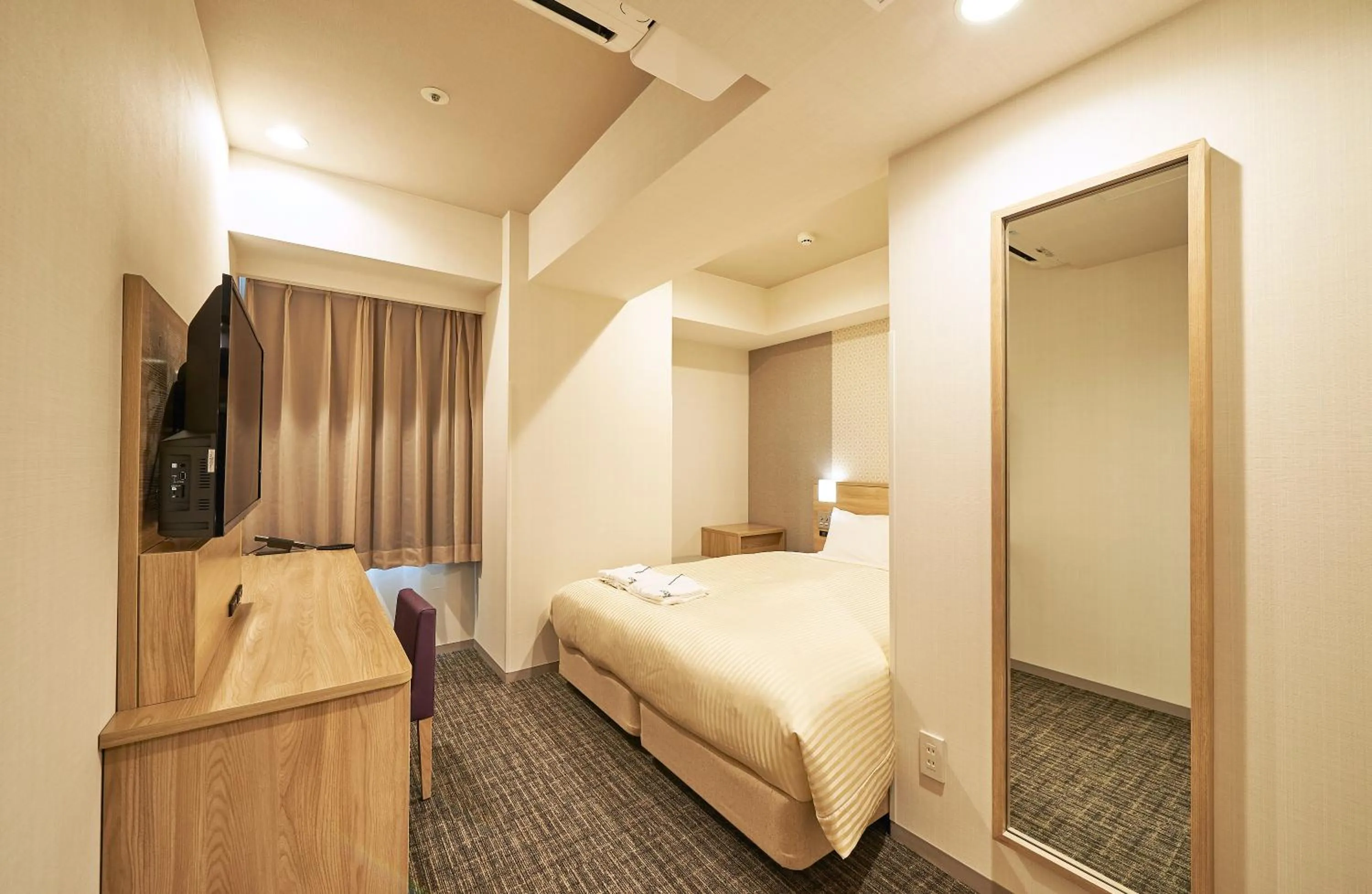 Bed in Sotetsu Fresa Inn Nagoya Sakuradoriguchi