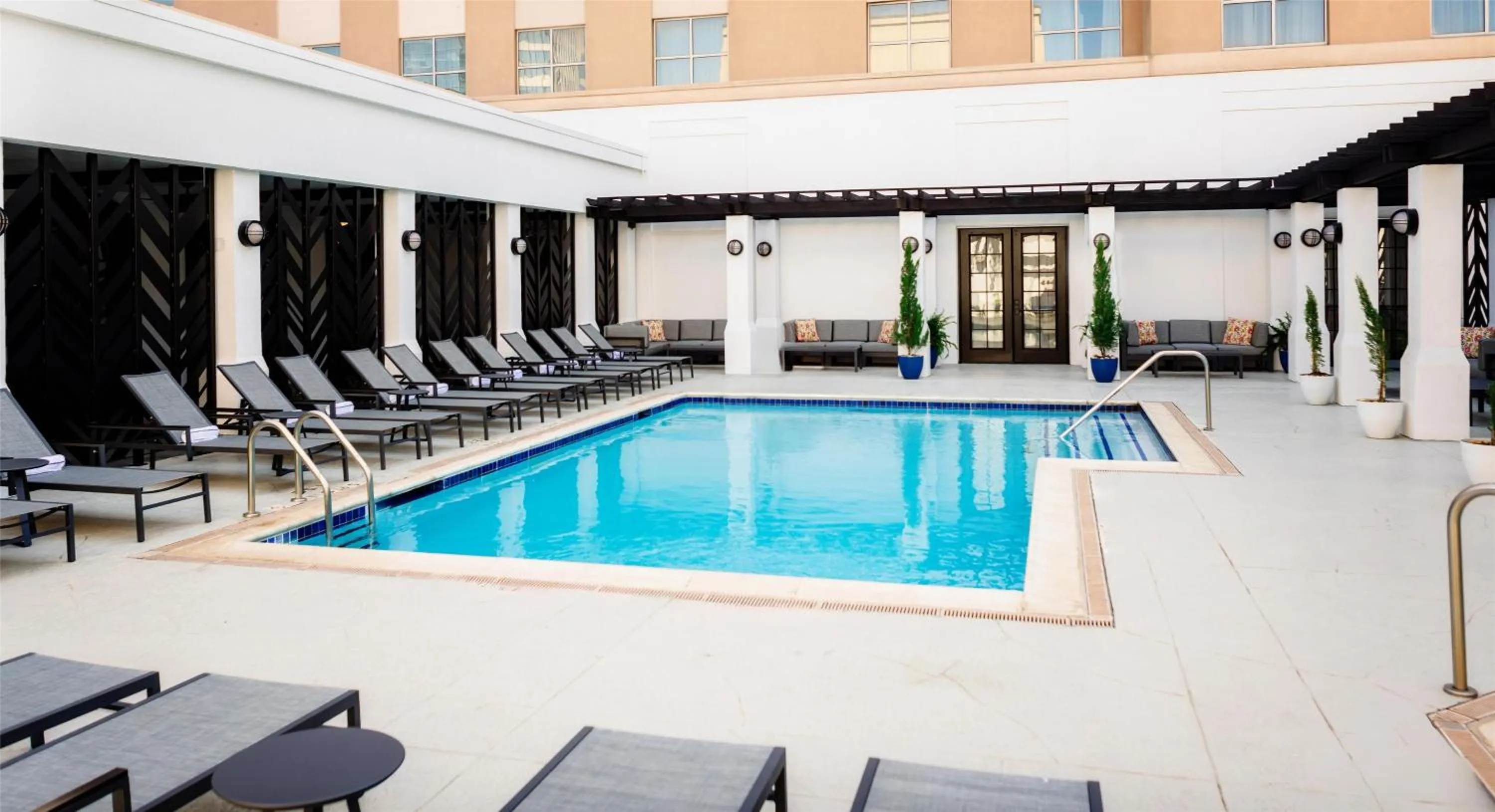Pool view in The Chifley Houston, Tapestry Collection by Hilton