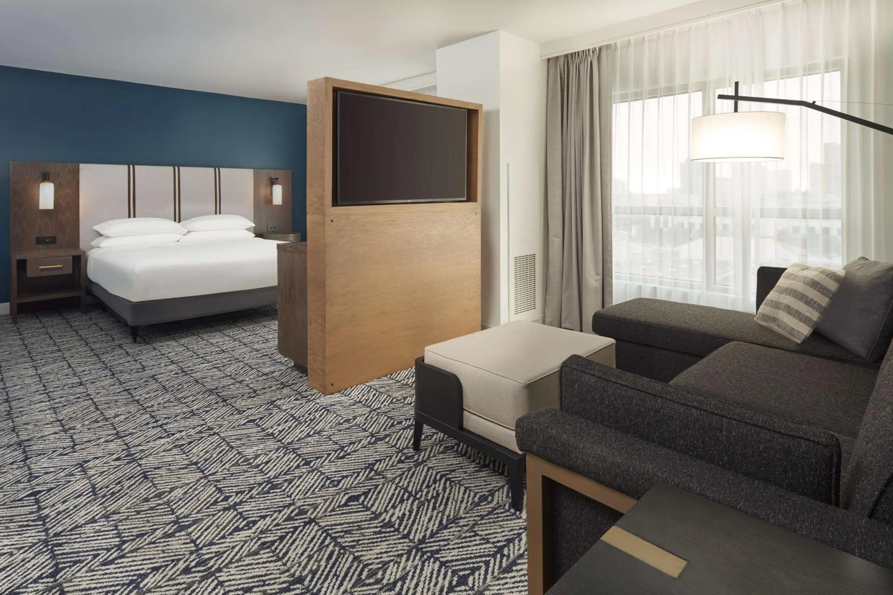 Living room, Bed in The Chifley Houston, Tapestry Collection by Hilton