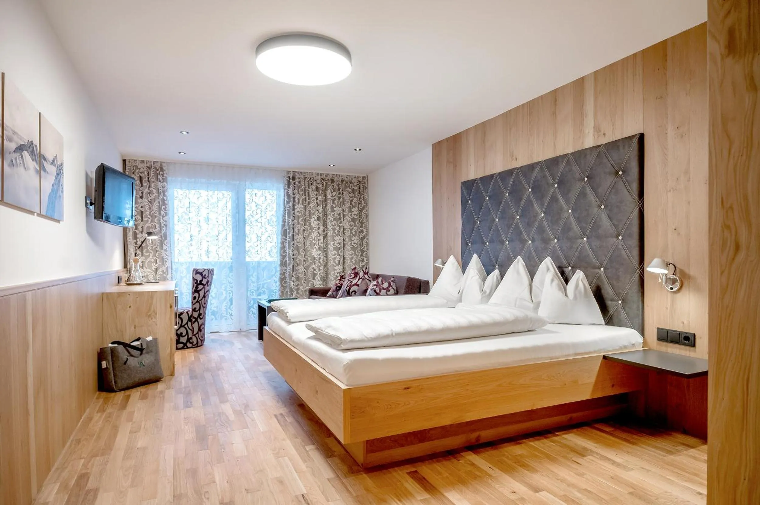 Bed in Hotel Angerer Alm